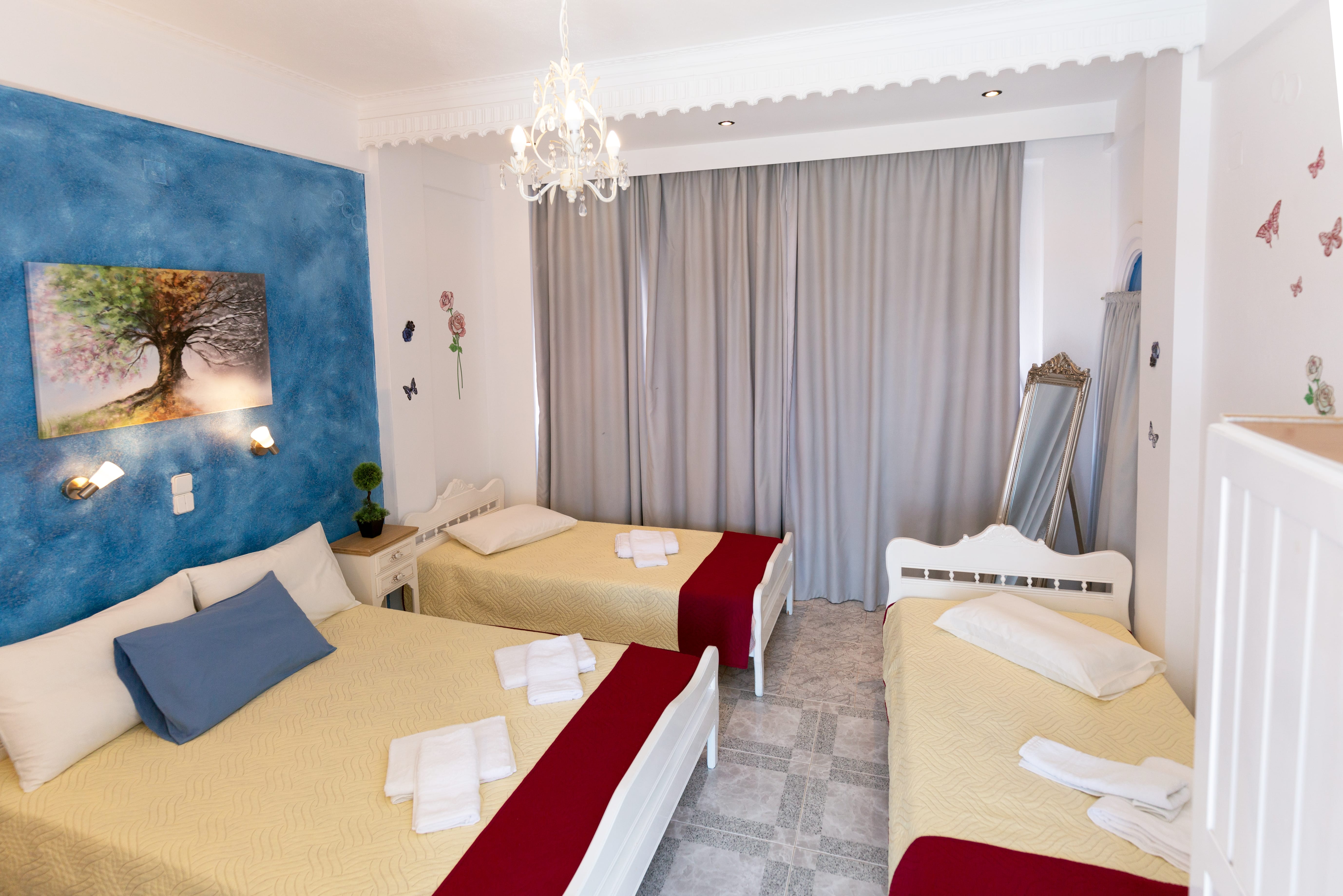 a room with a bed and couches