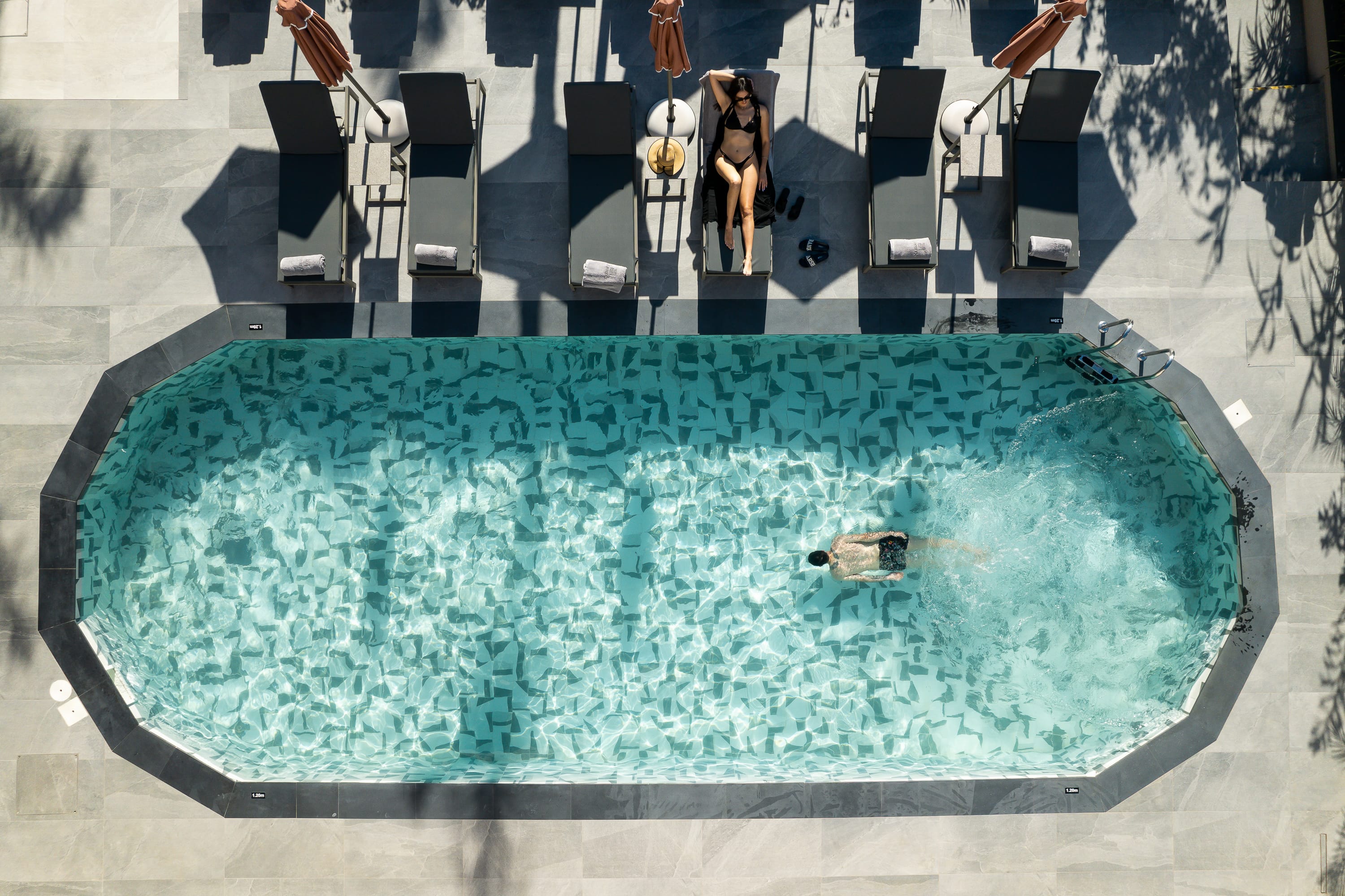 a person swimming in a pool