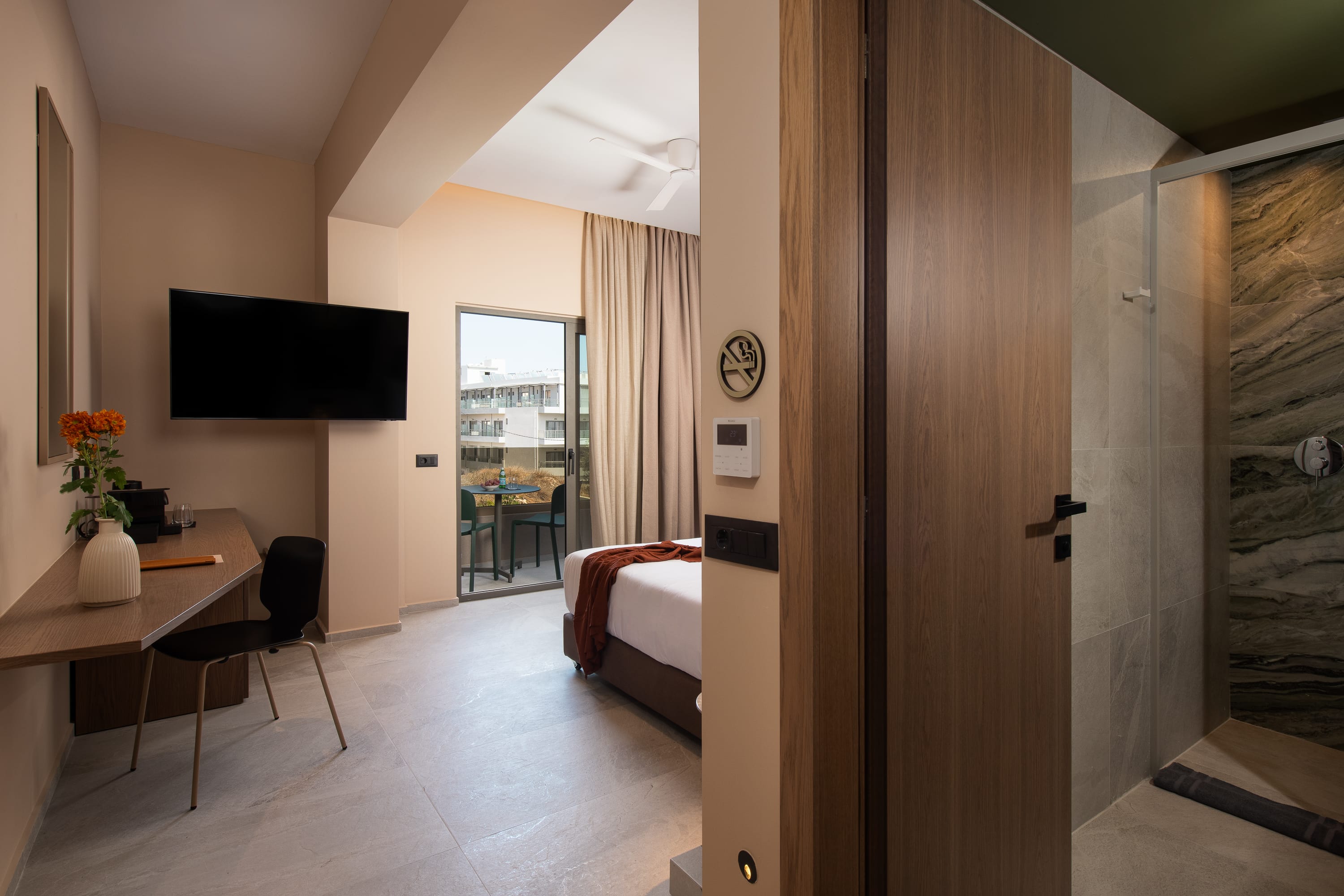 a room with a tv and a bed