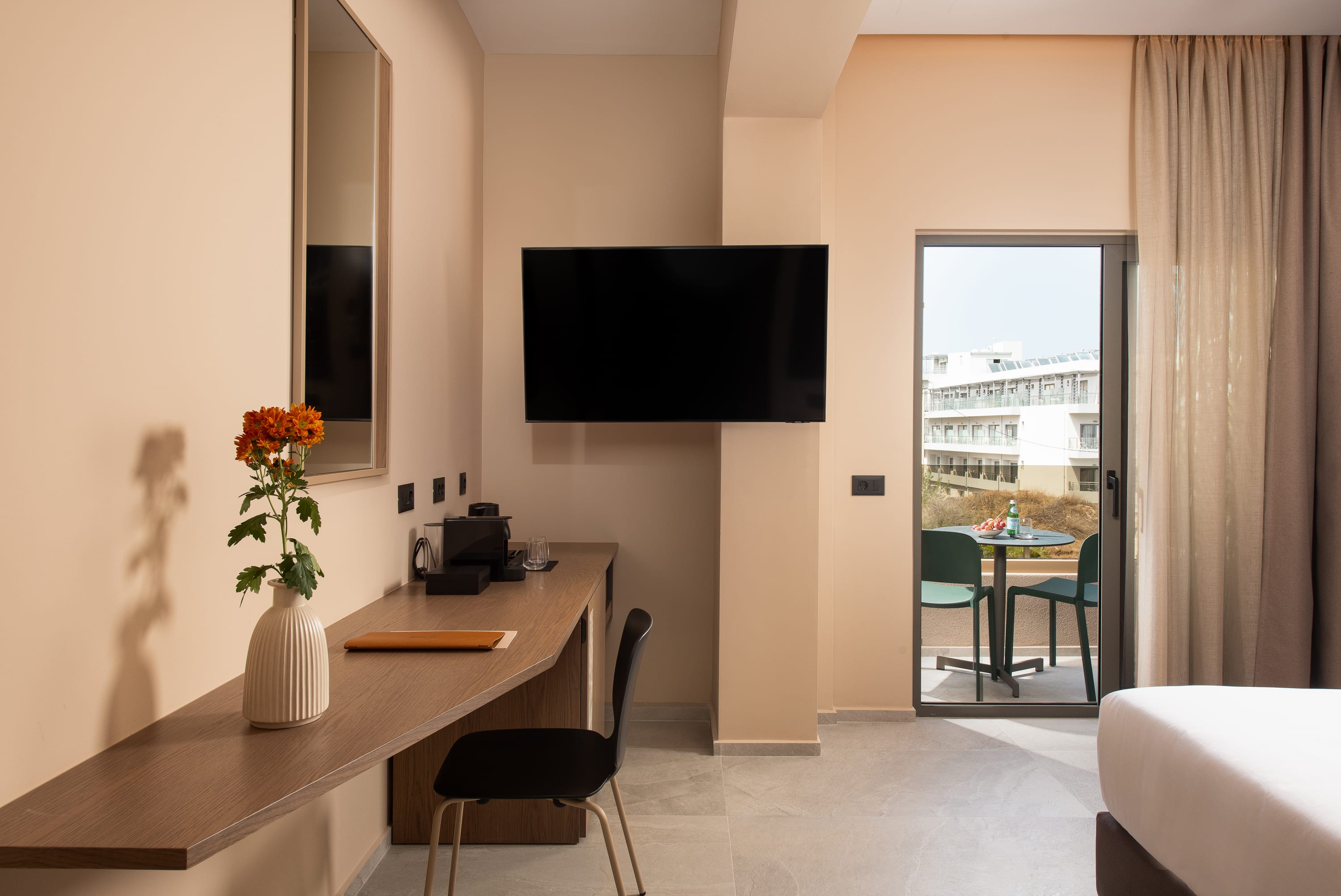 a room with a tv and chairs