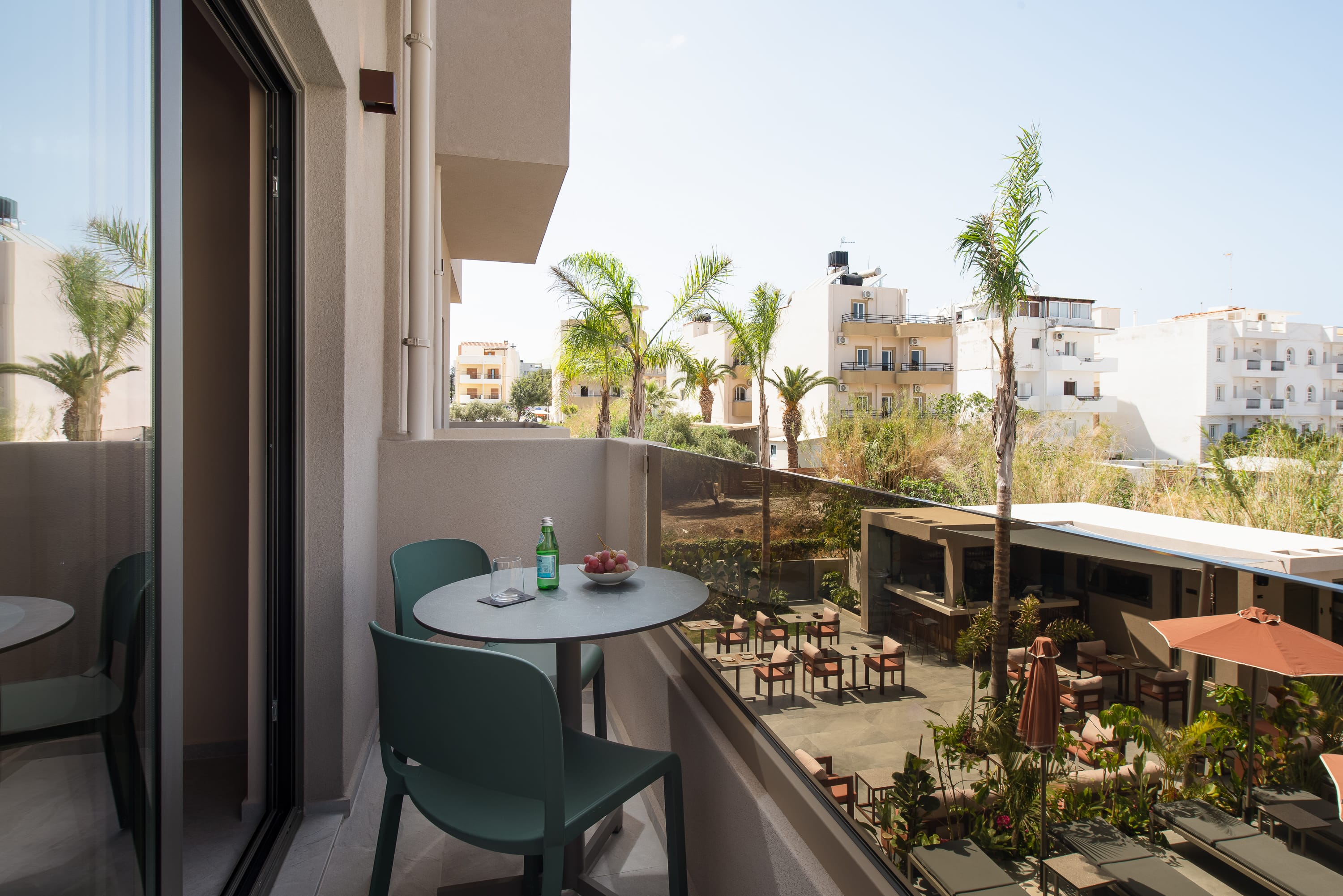 a table and chairs on a balcony