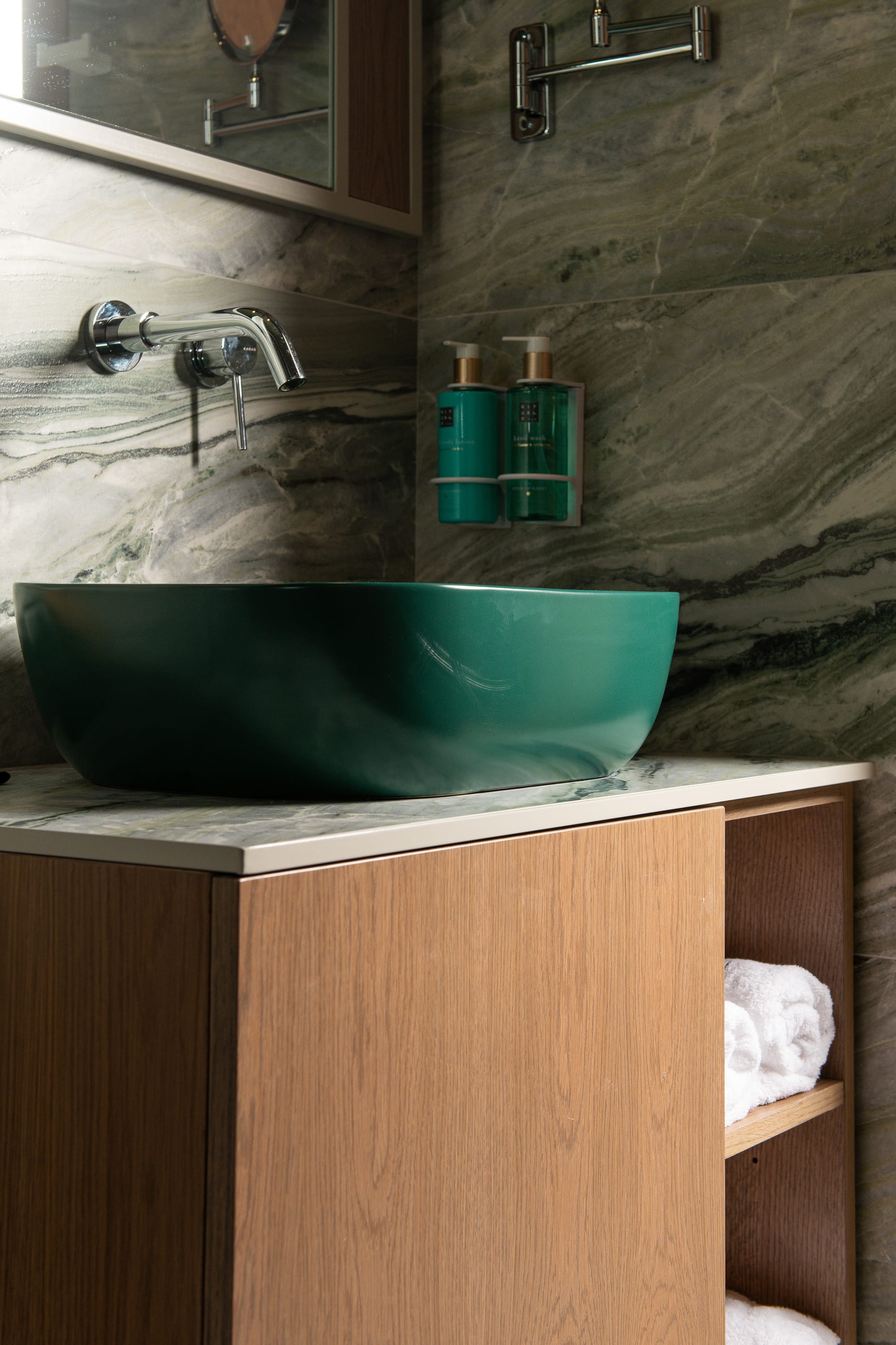 a green tub with blue cups on top of it