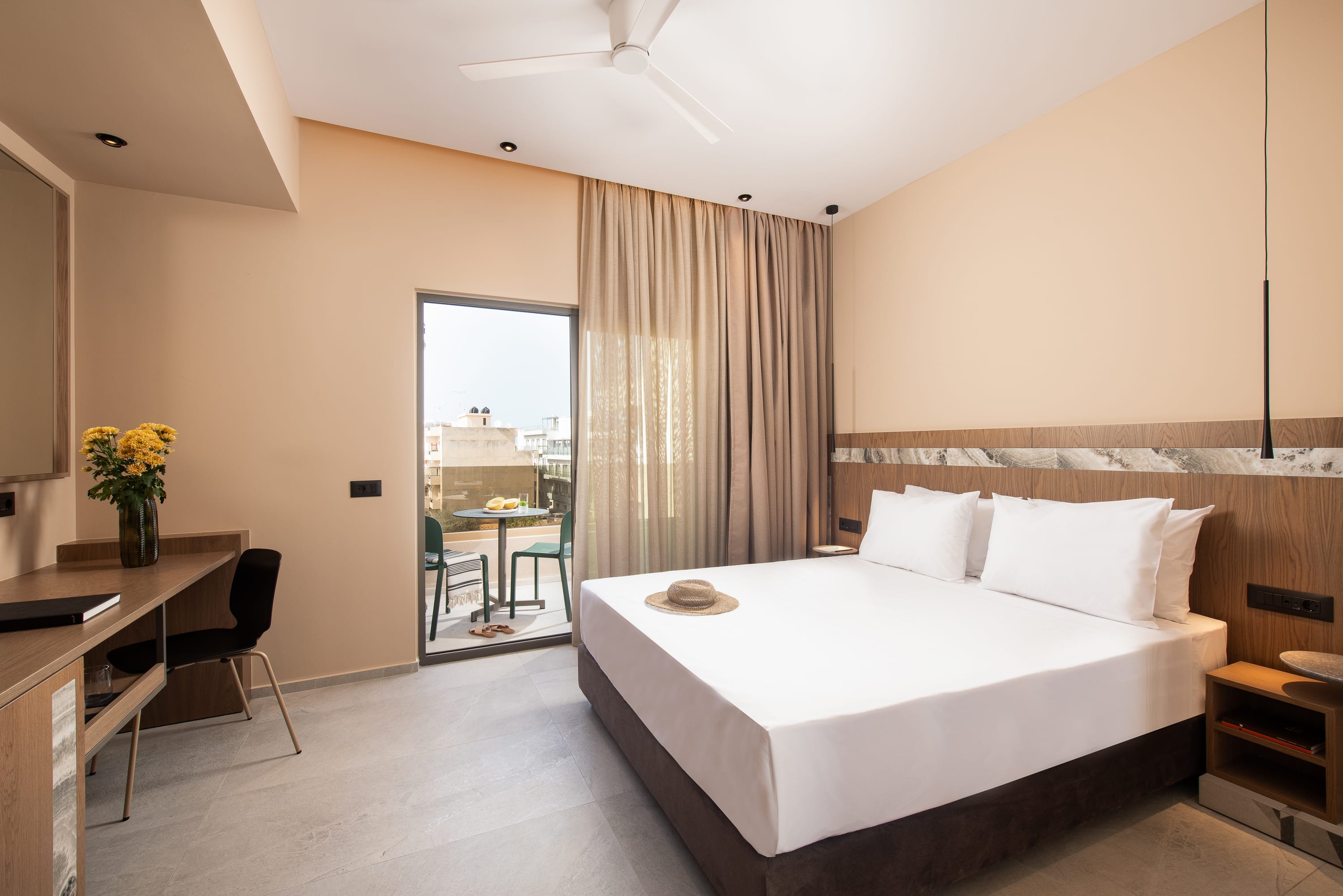 a bedroom with a bed and a desk