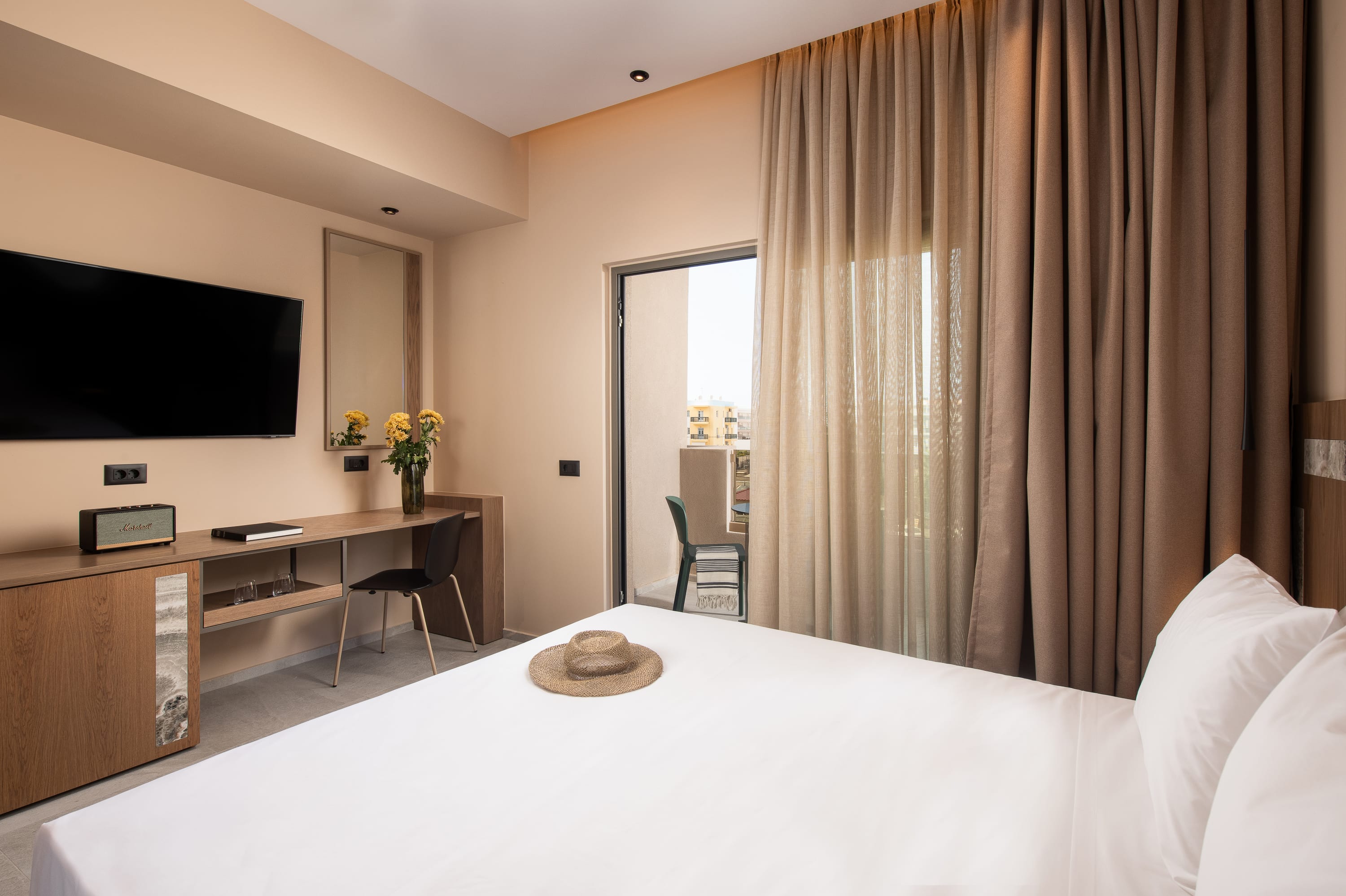 a hotel room with a bed and a tv