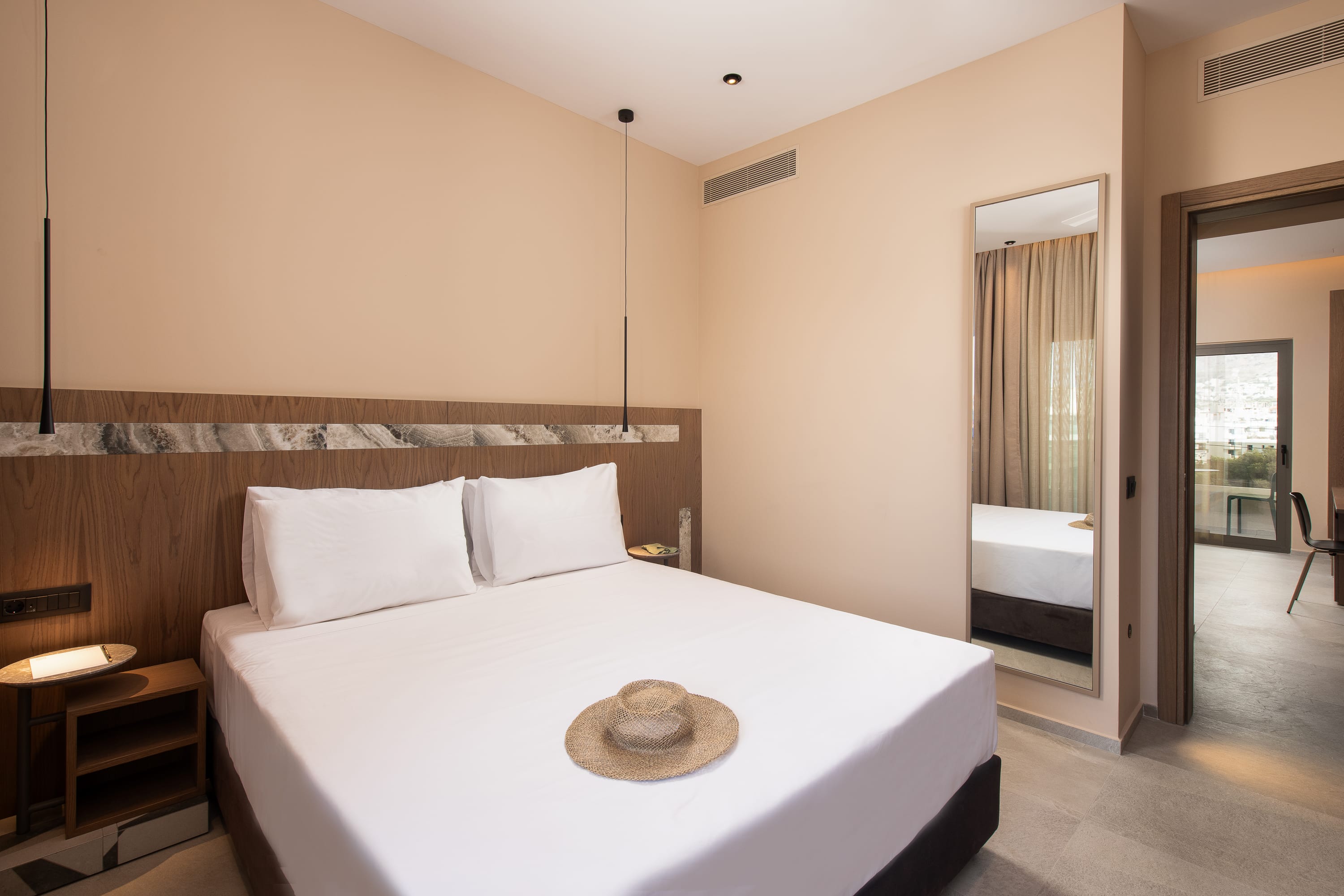 a hotel room with a bed and a table