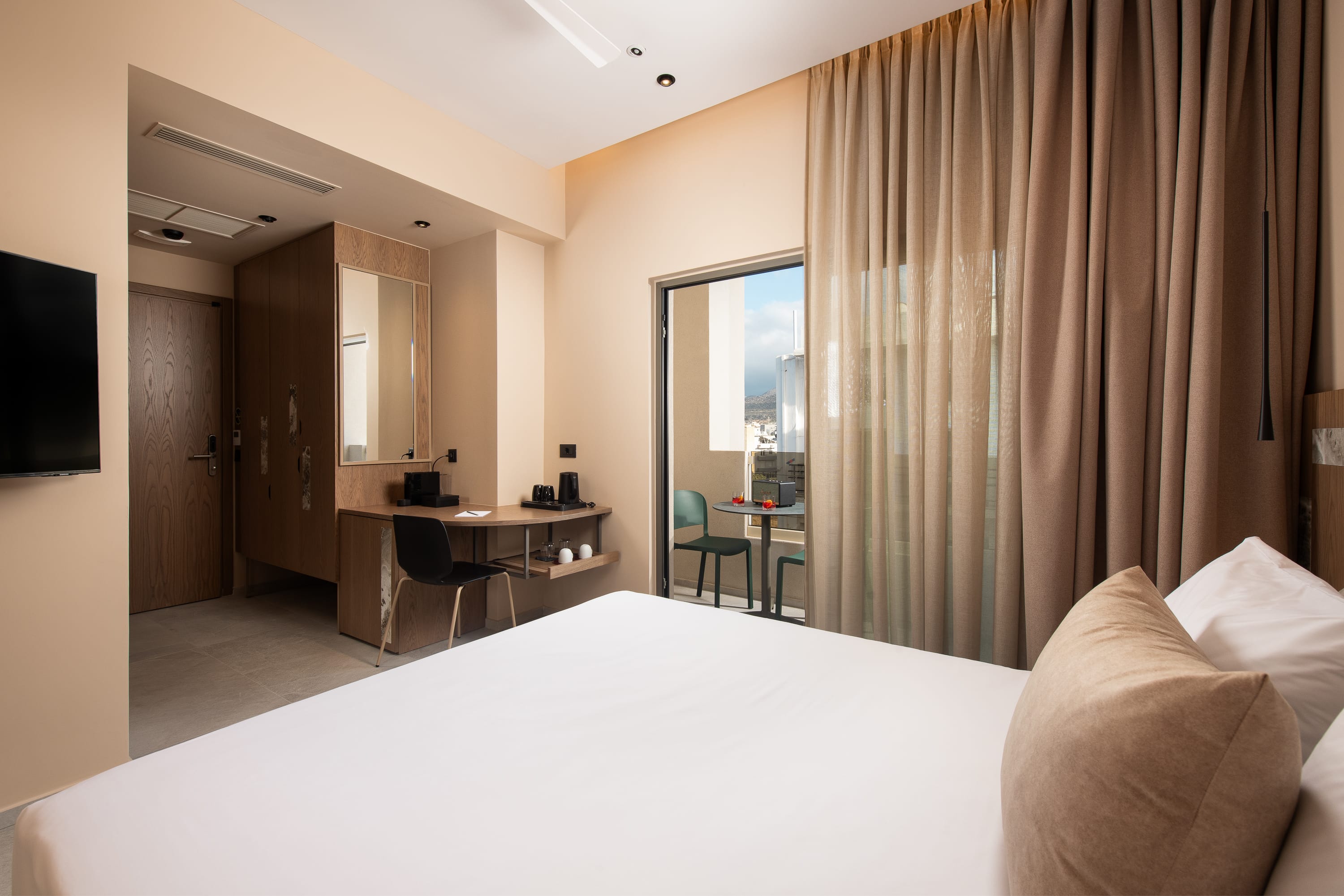 a room with a bed and a desk