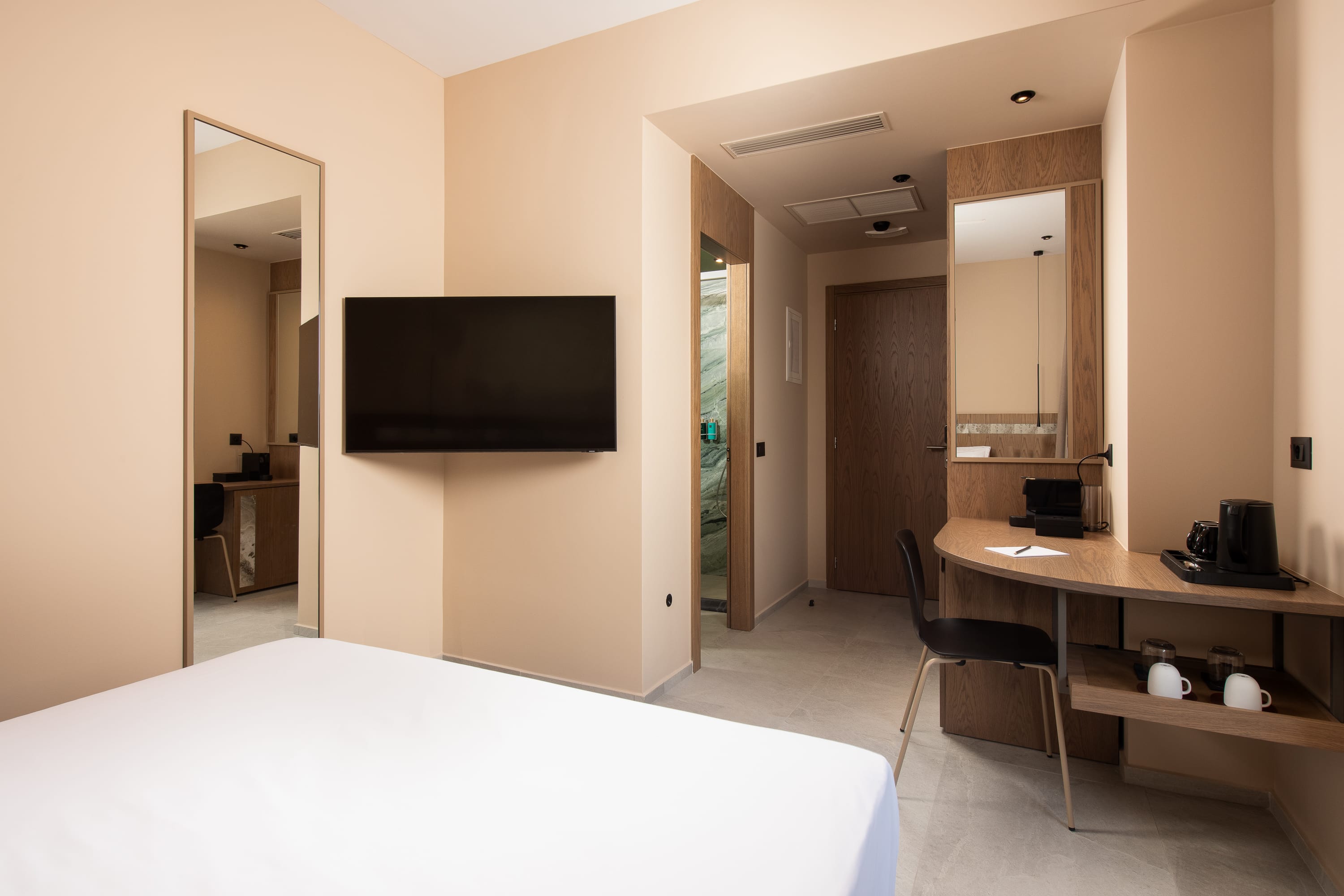 a room with a tv and a desk