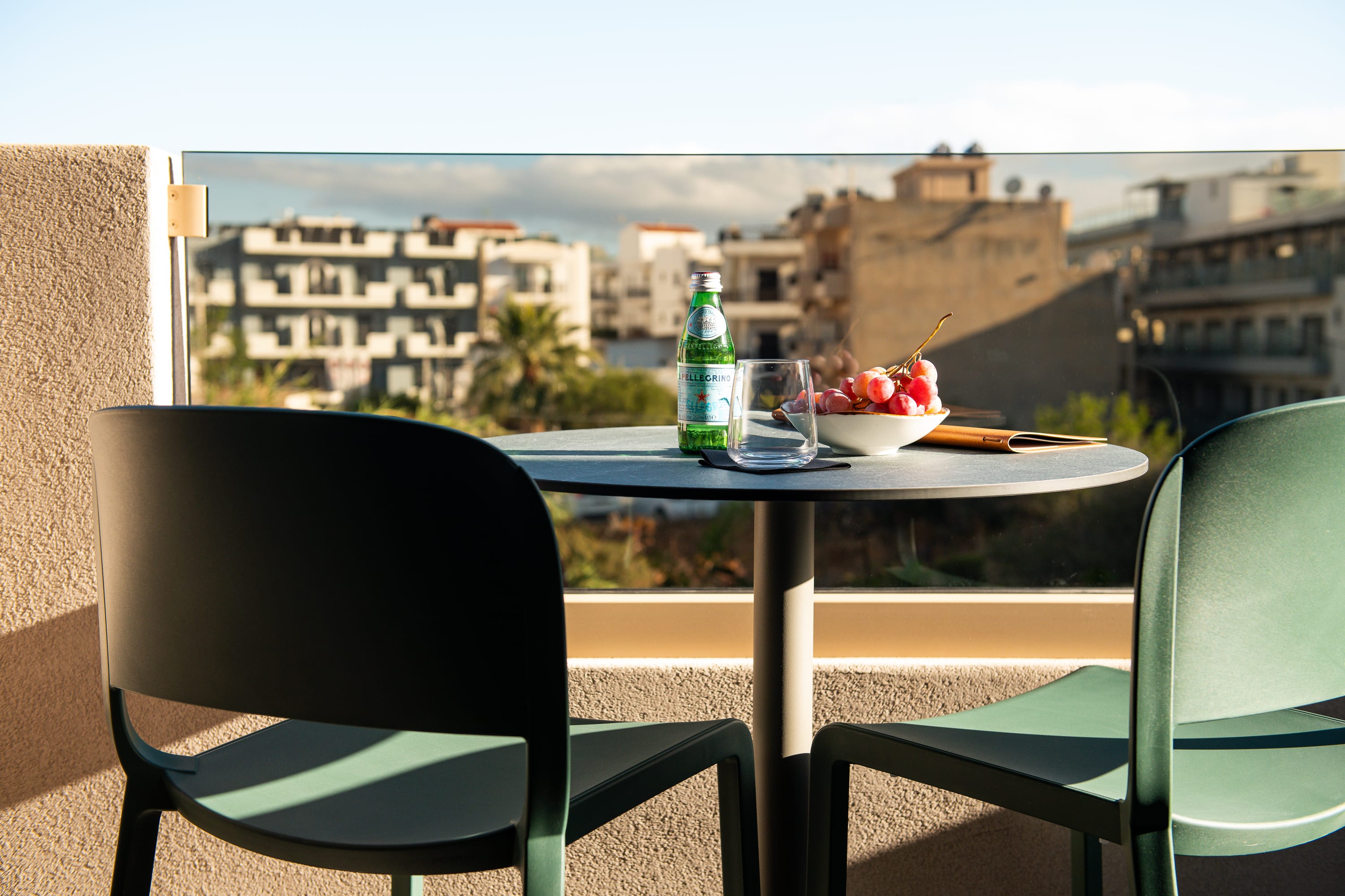a table with a bottle of wine and glasses on it