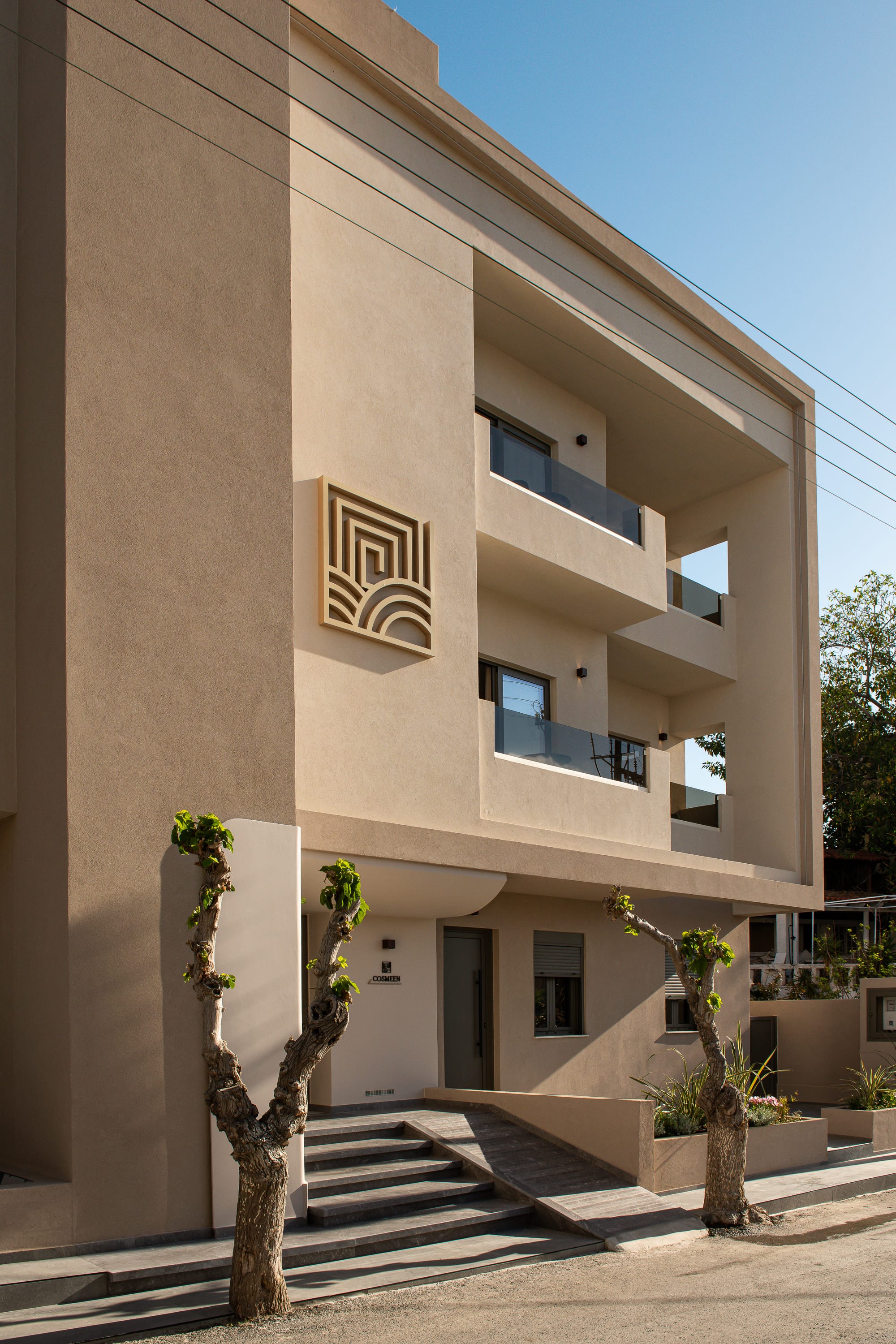 a building with stairs and trees