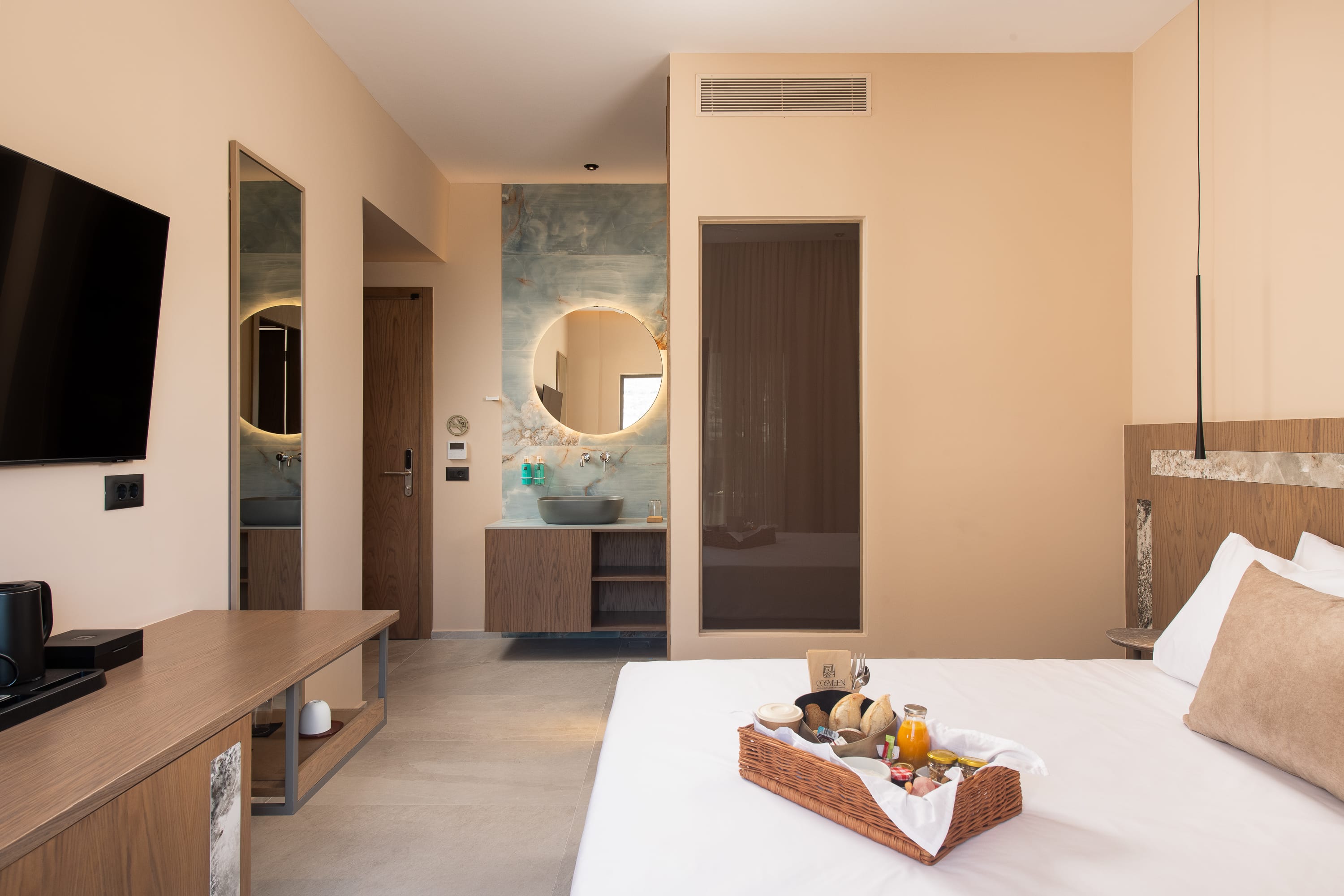 a bedroom with a bed and a tv