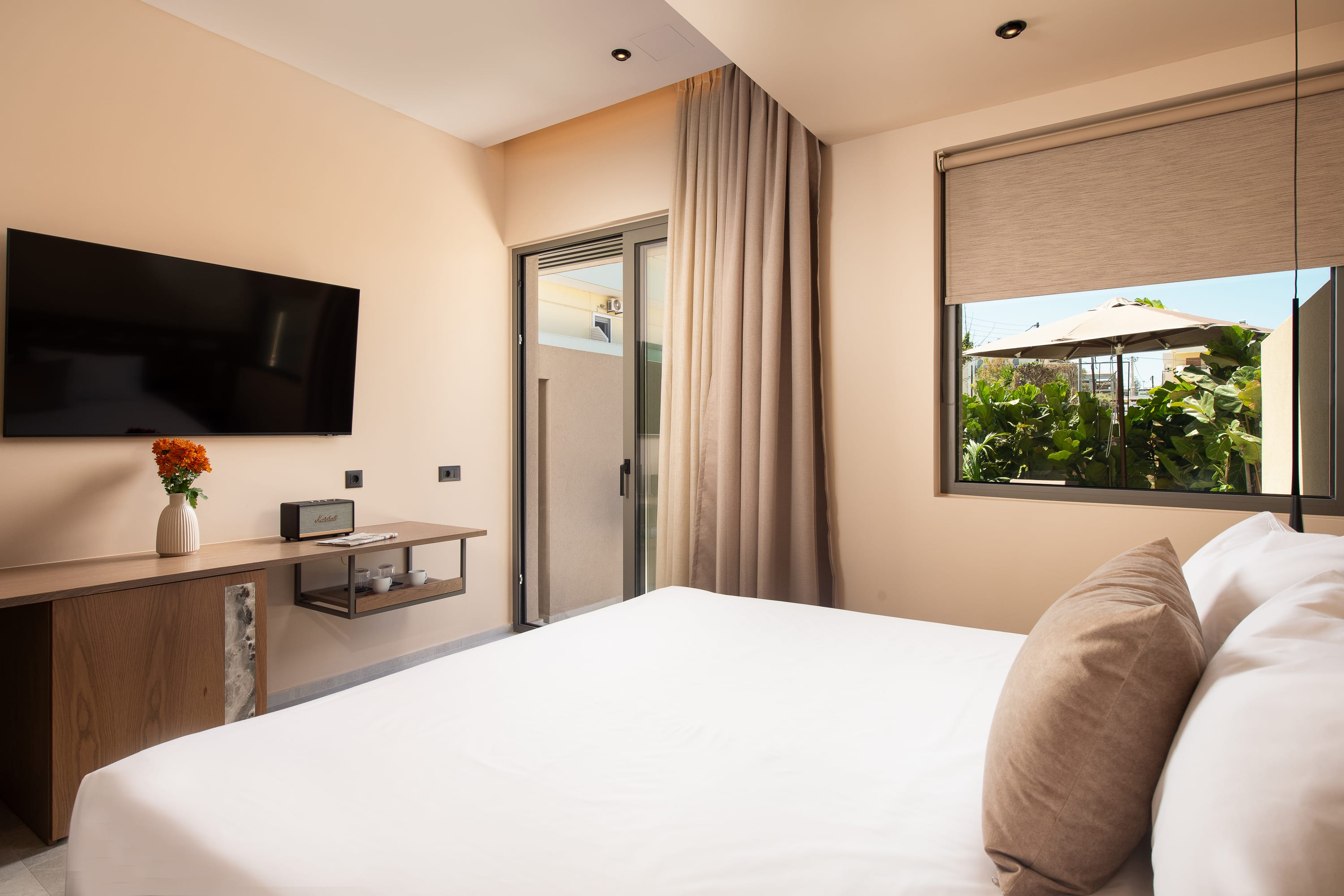 a bedroom with a bed and a desk