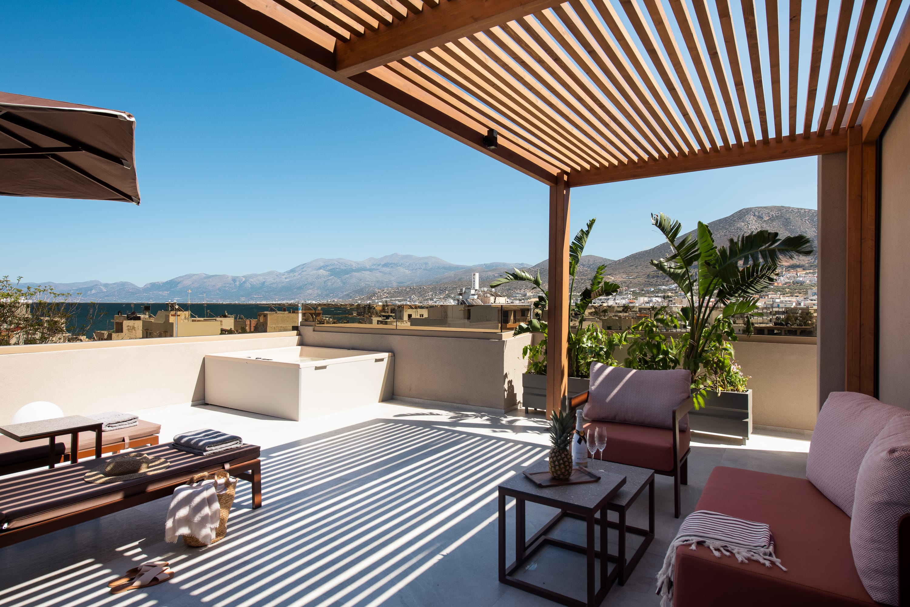 a room with a view of the mountains and the ocean