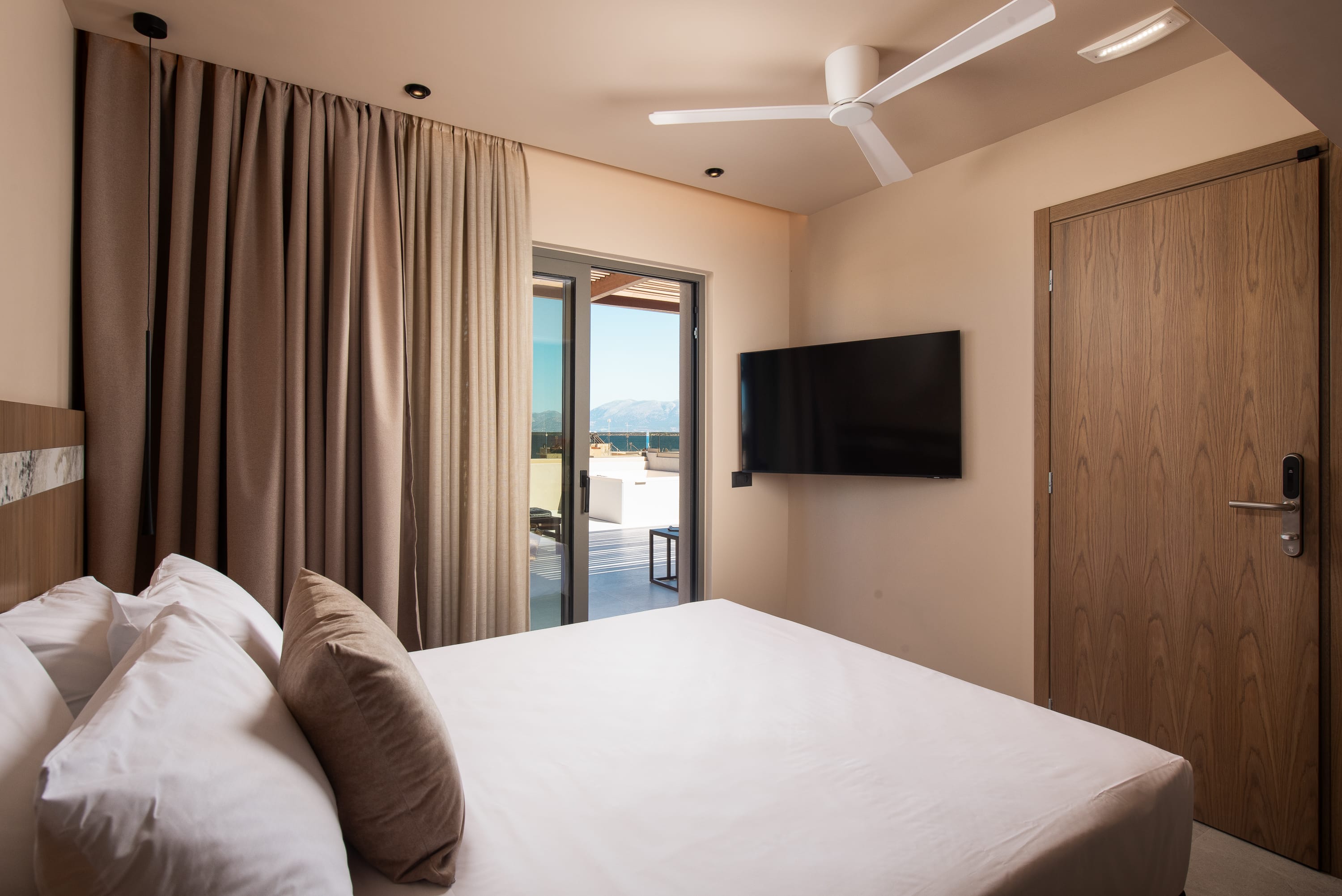 a bedroom with a tv and a bed