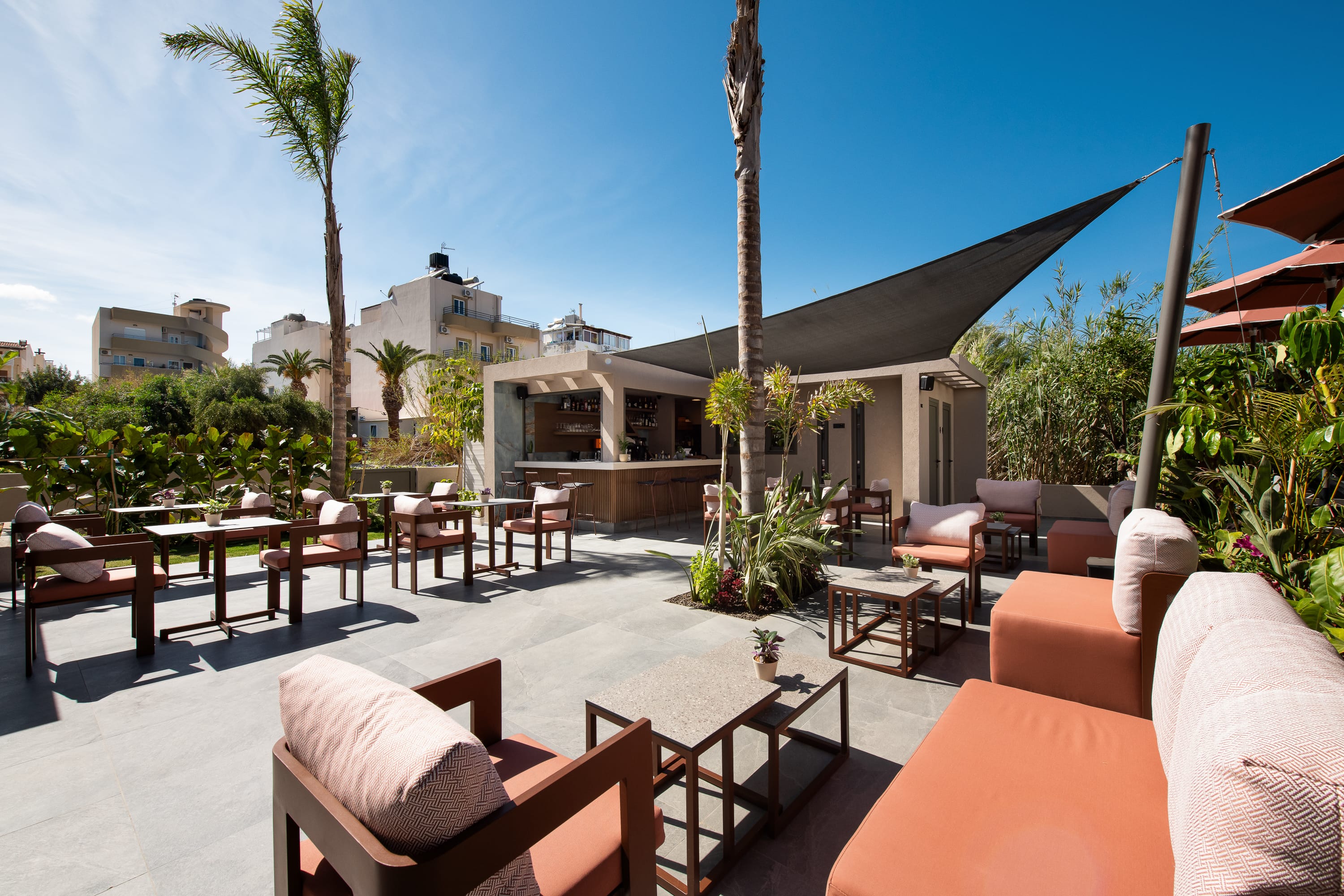 a patio with tables and chairs