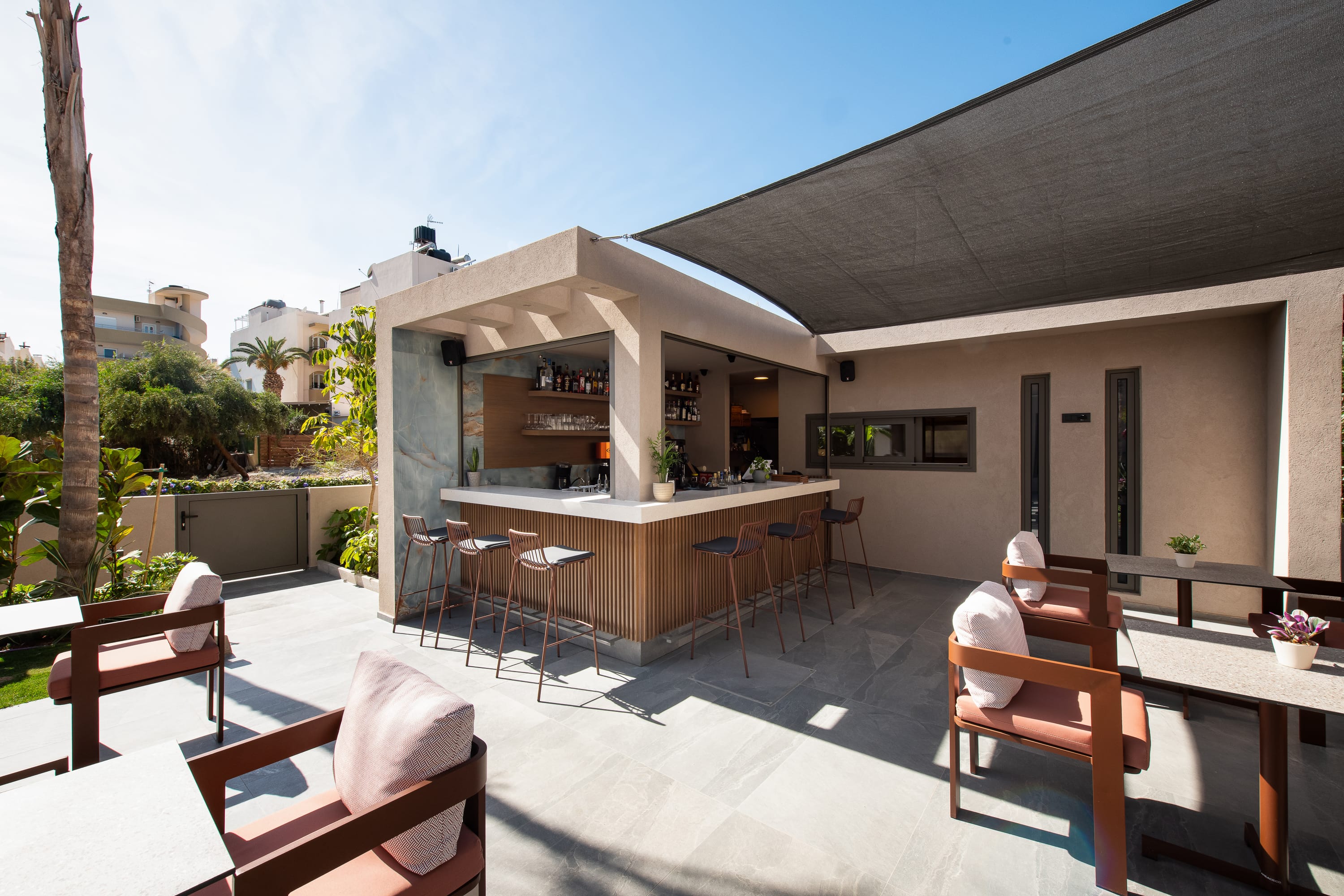 a patio with tables and chairs