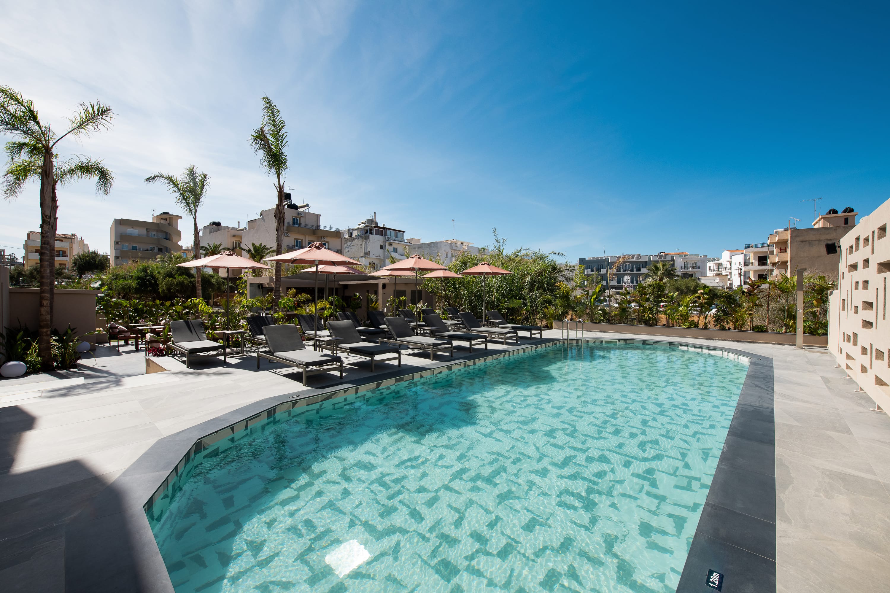 a pool with chairs around it