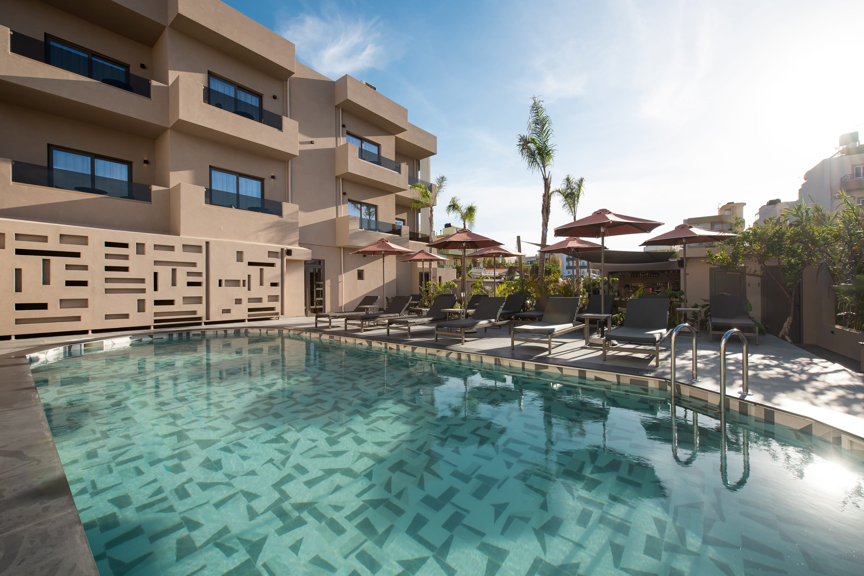 a swimming pool in front of a building