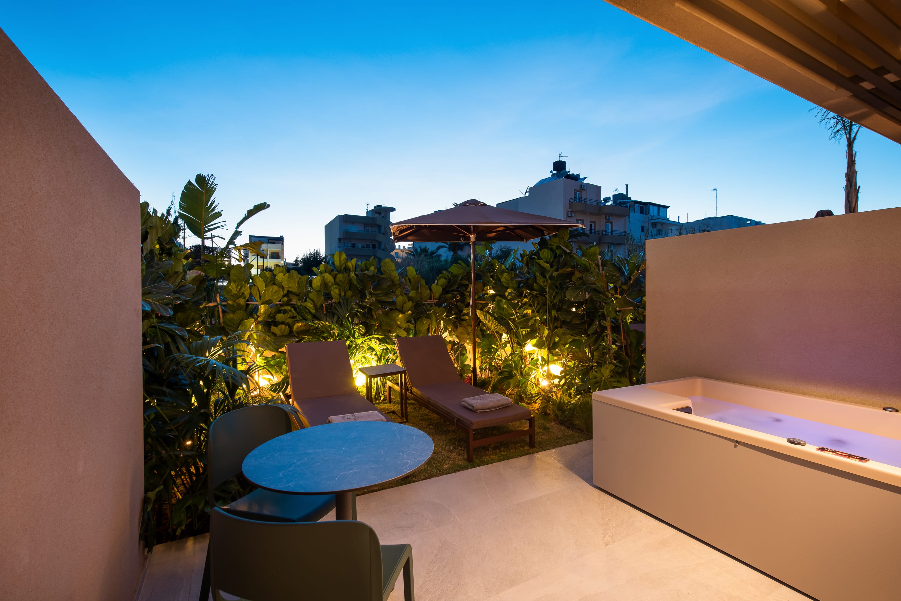 a pool and chairs outside