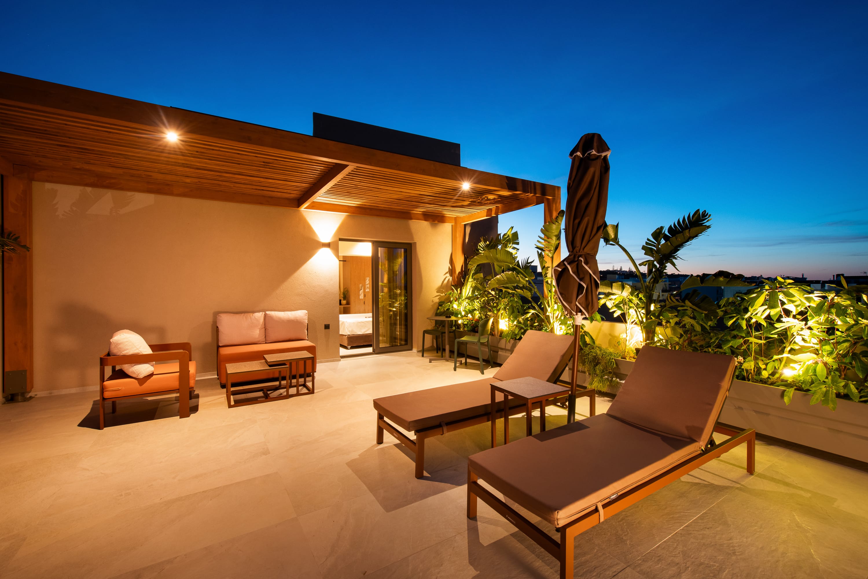 a house with a pool and lounge chairs