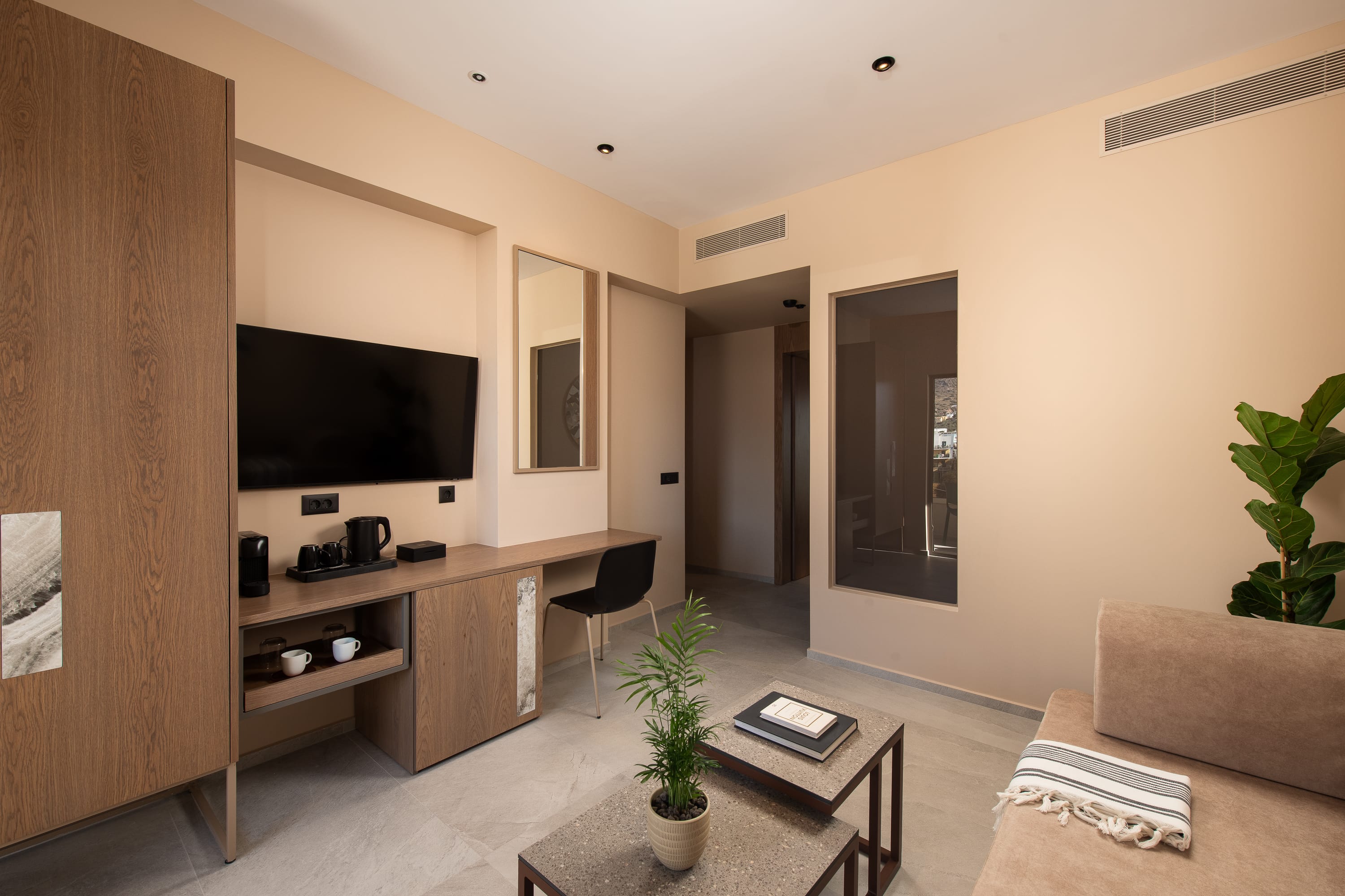 a living room with a tv and furniture