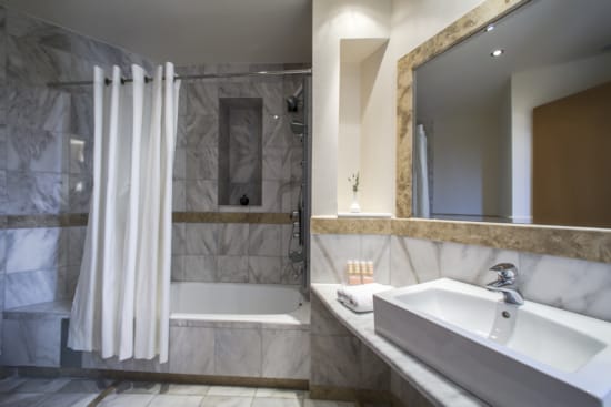 a bathroom with a large mirror