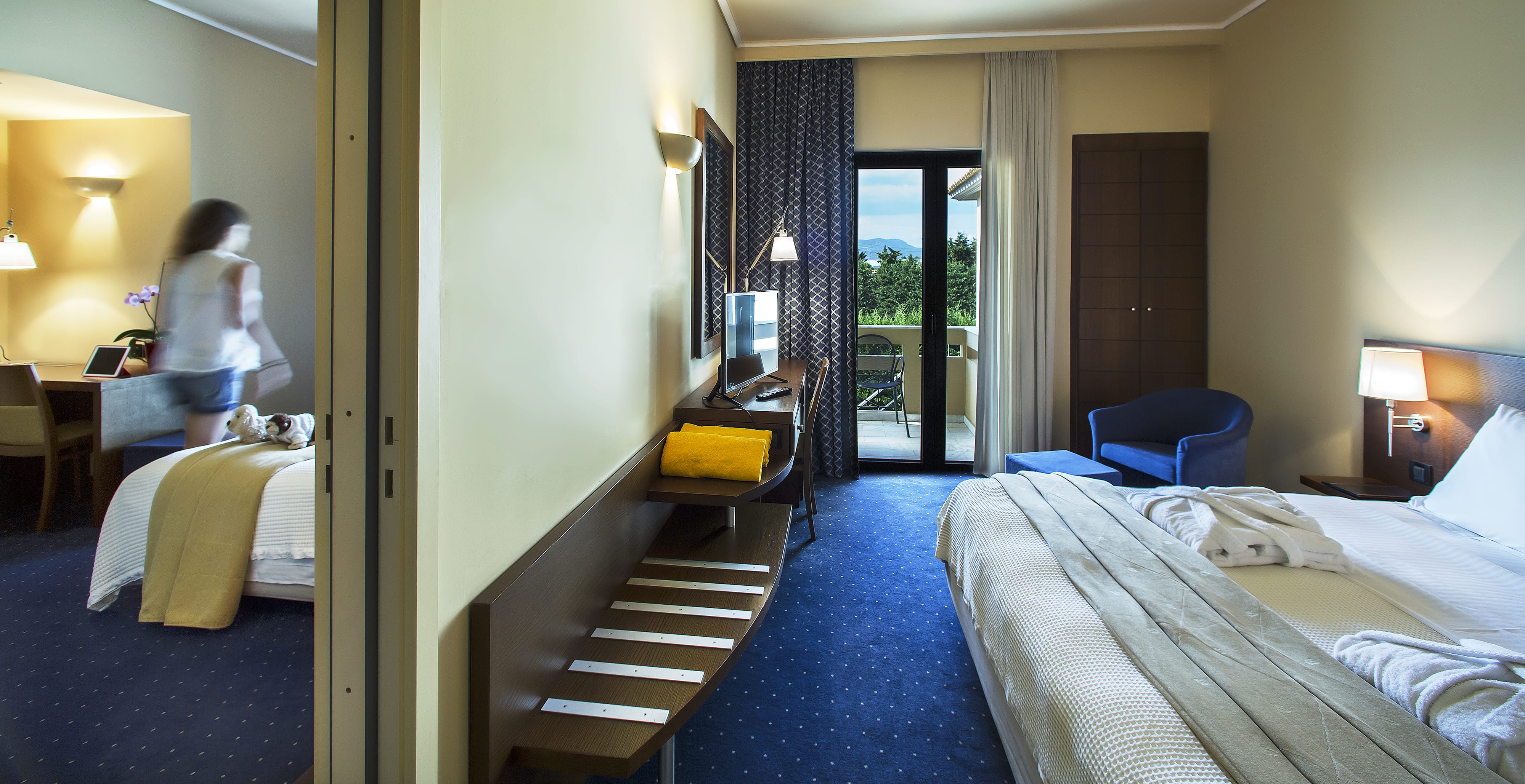 a room with beds and a staircase