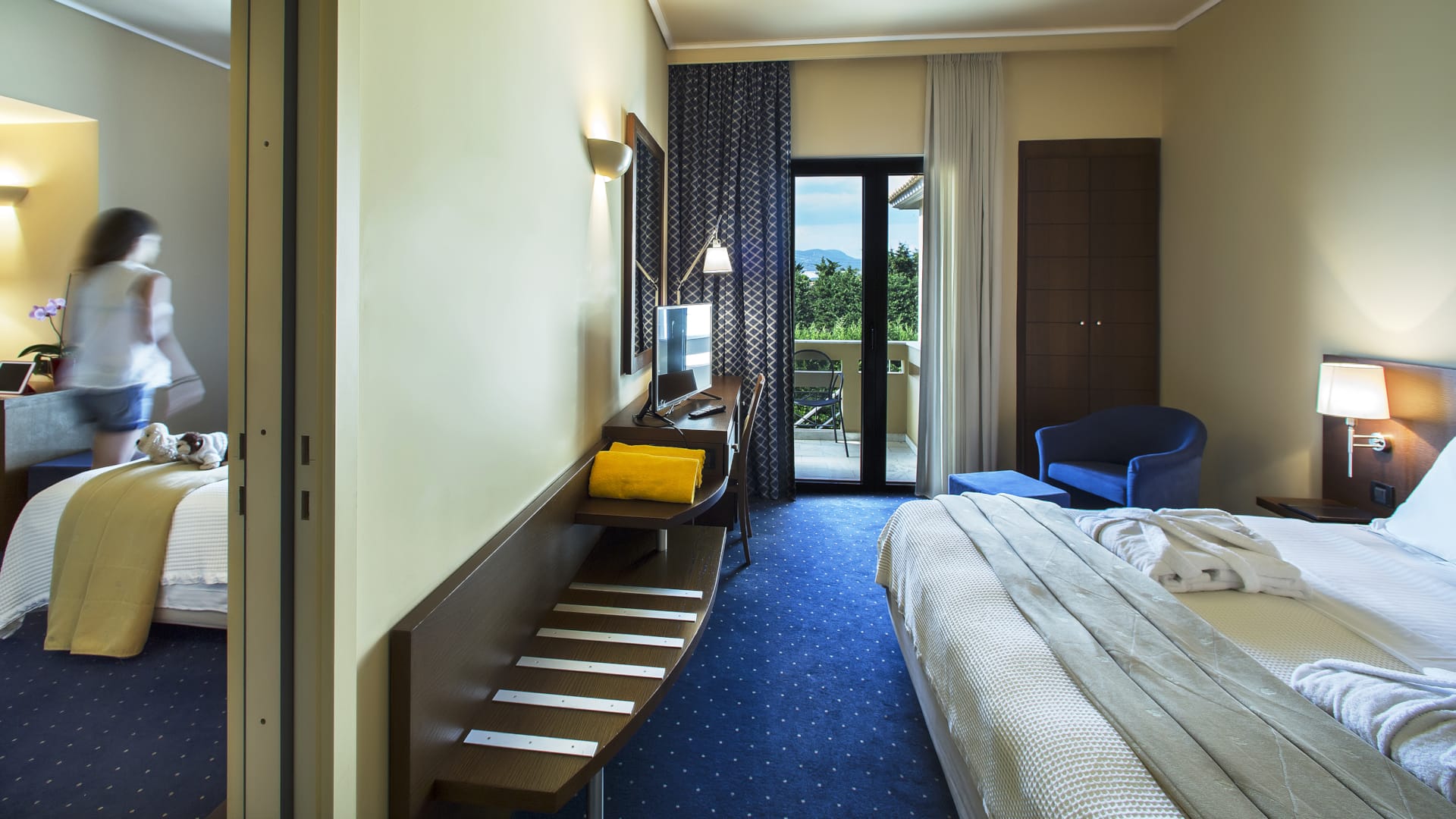 a room with beds and a staircase