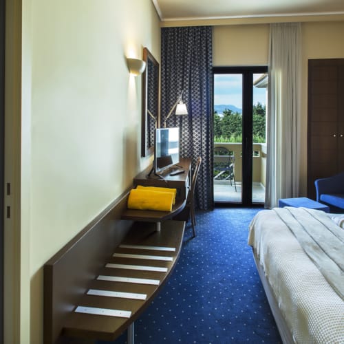 a room with beds and a staircase