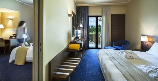 a room with beds and a staircase