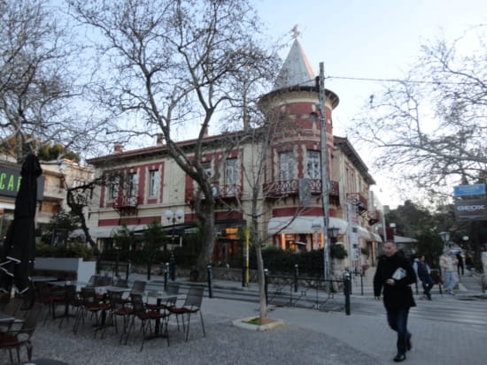 a building with tables and chairs outside