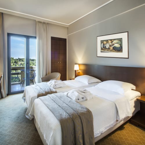 a hotel room with two beds