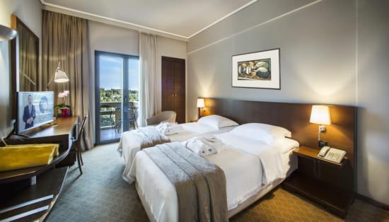 a hotel room with two beds