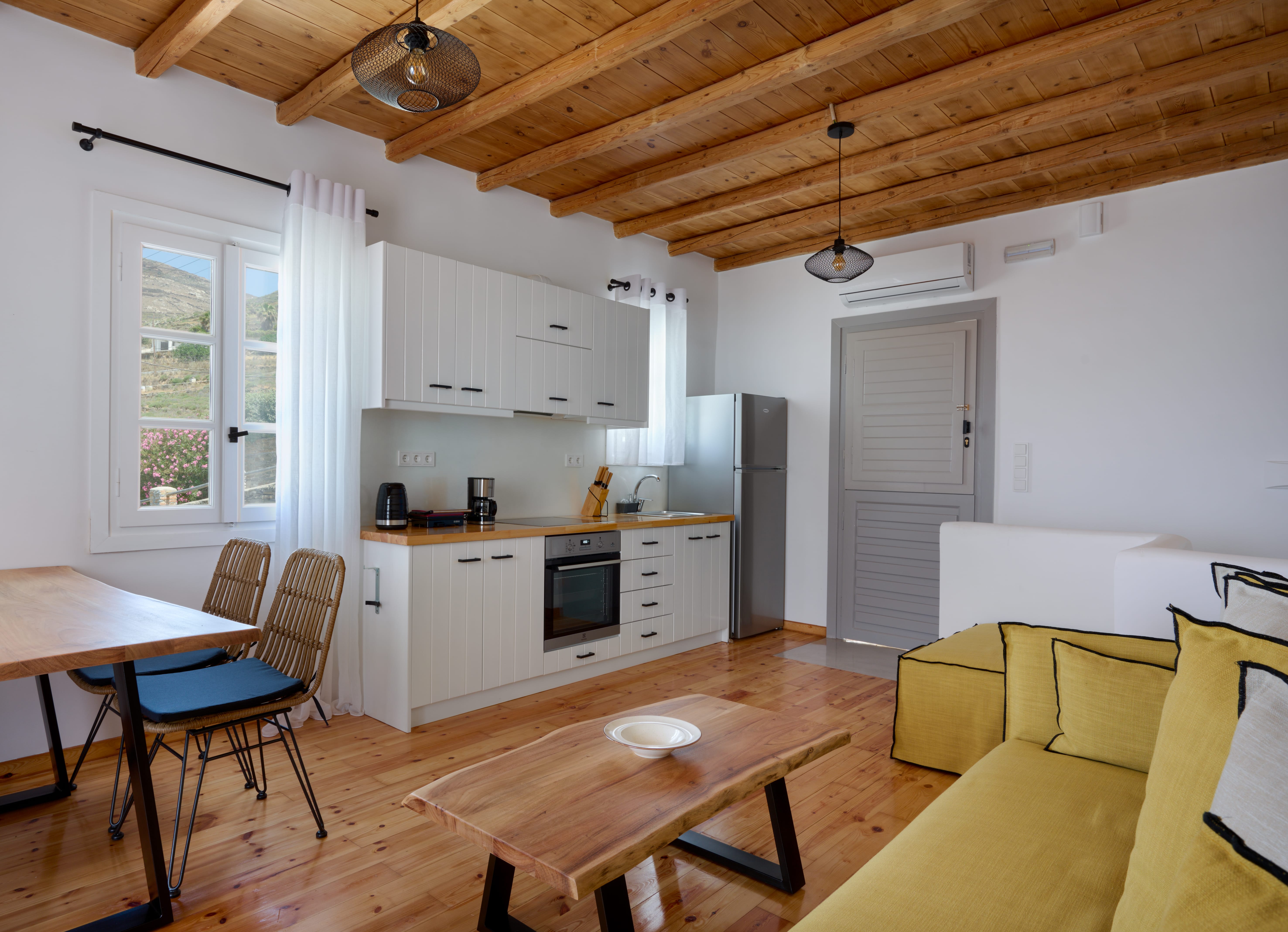 a kitchen with a table and chairs