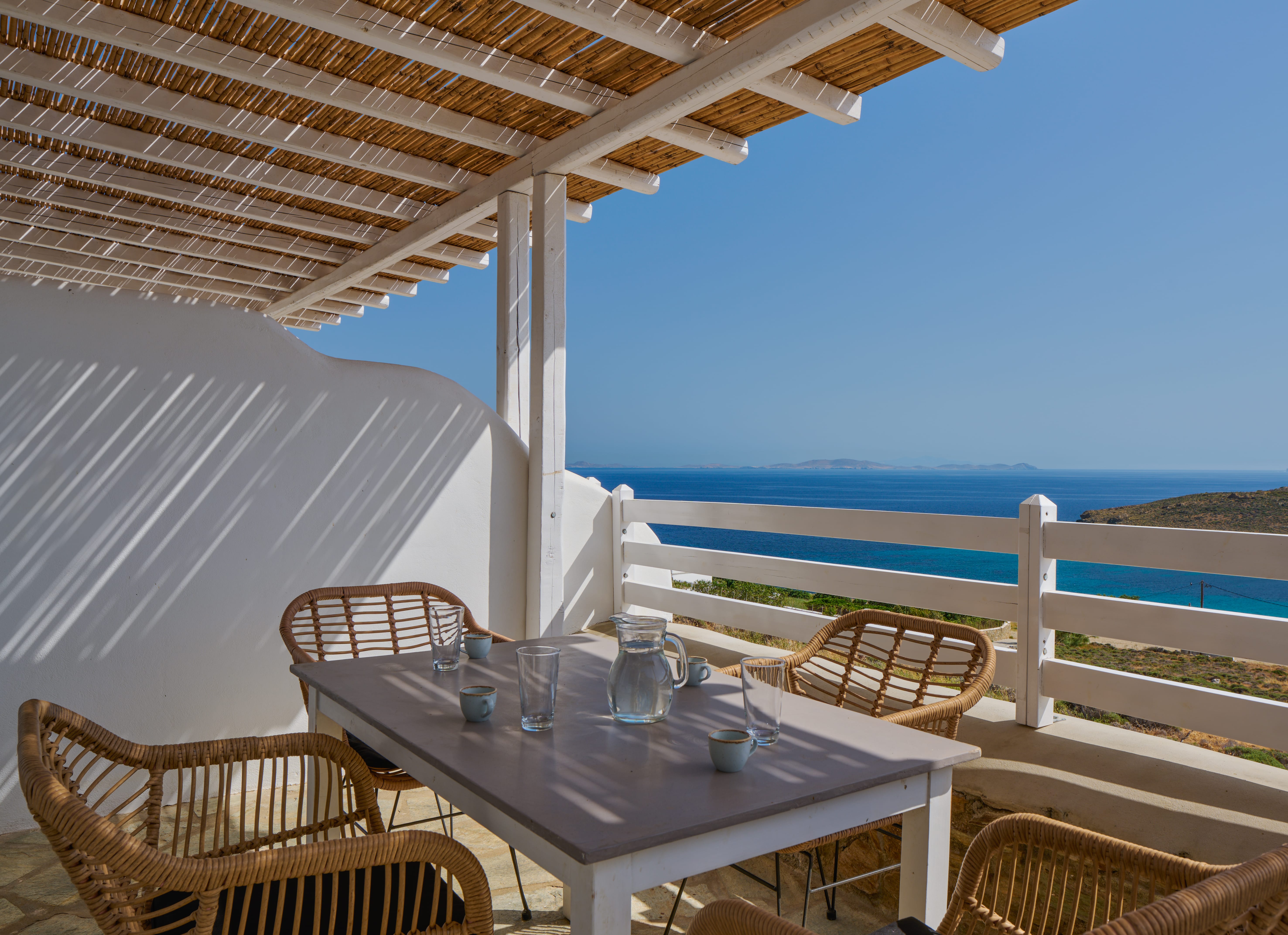 a table and chairs on a deck
