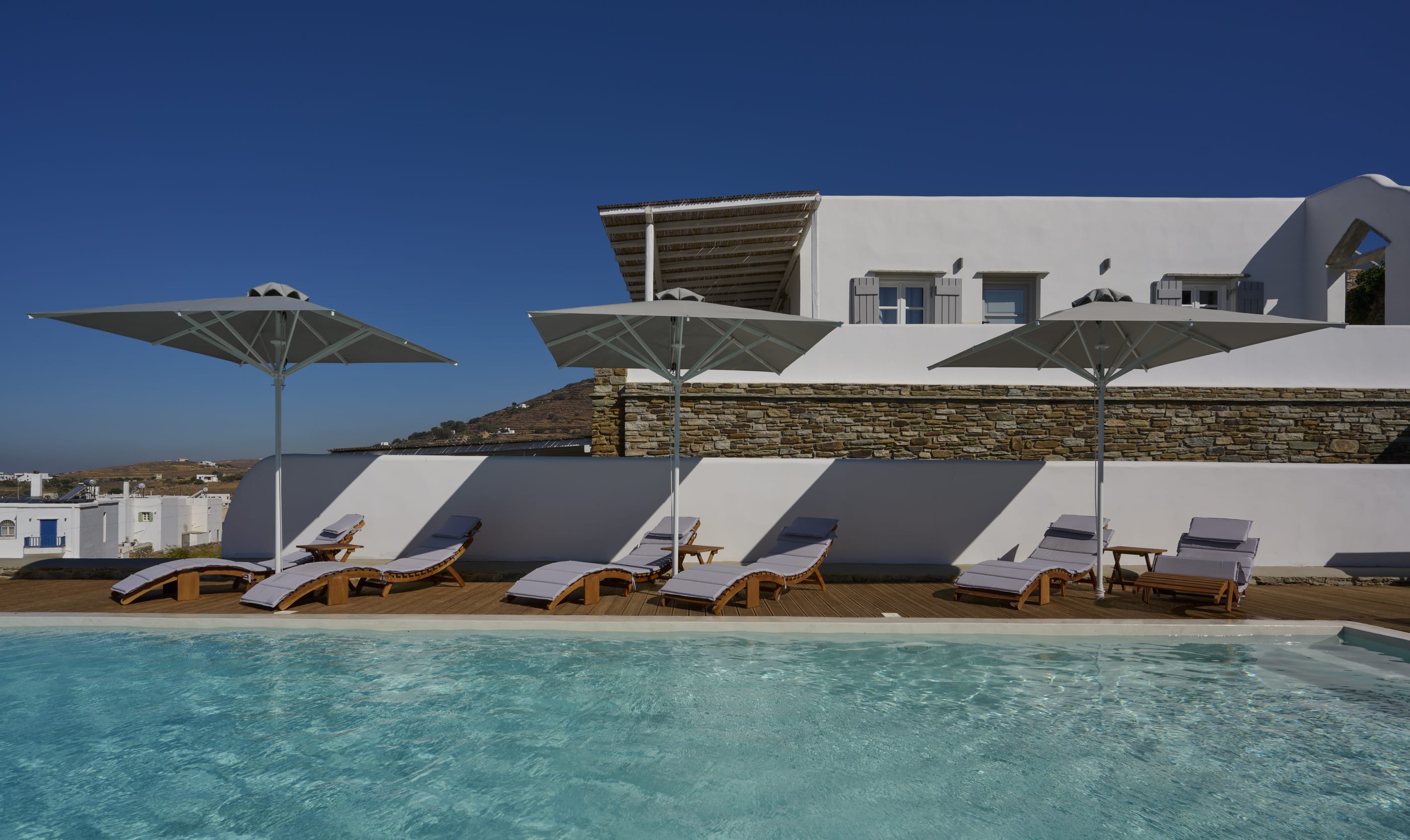 a row of white buildings on a beach