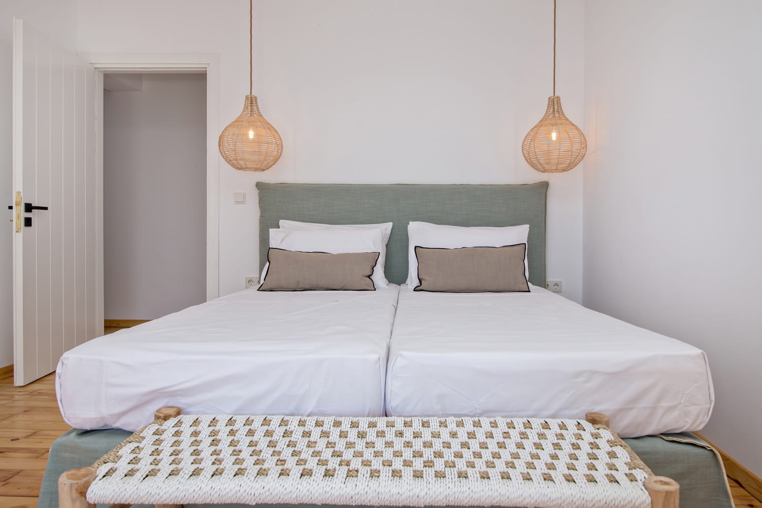 a couple of beds in a room