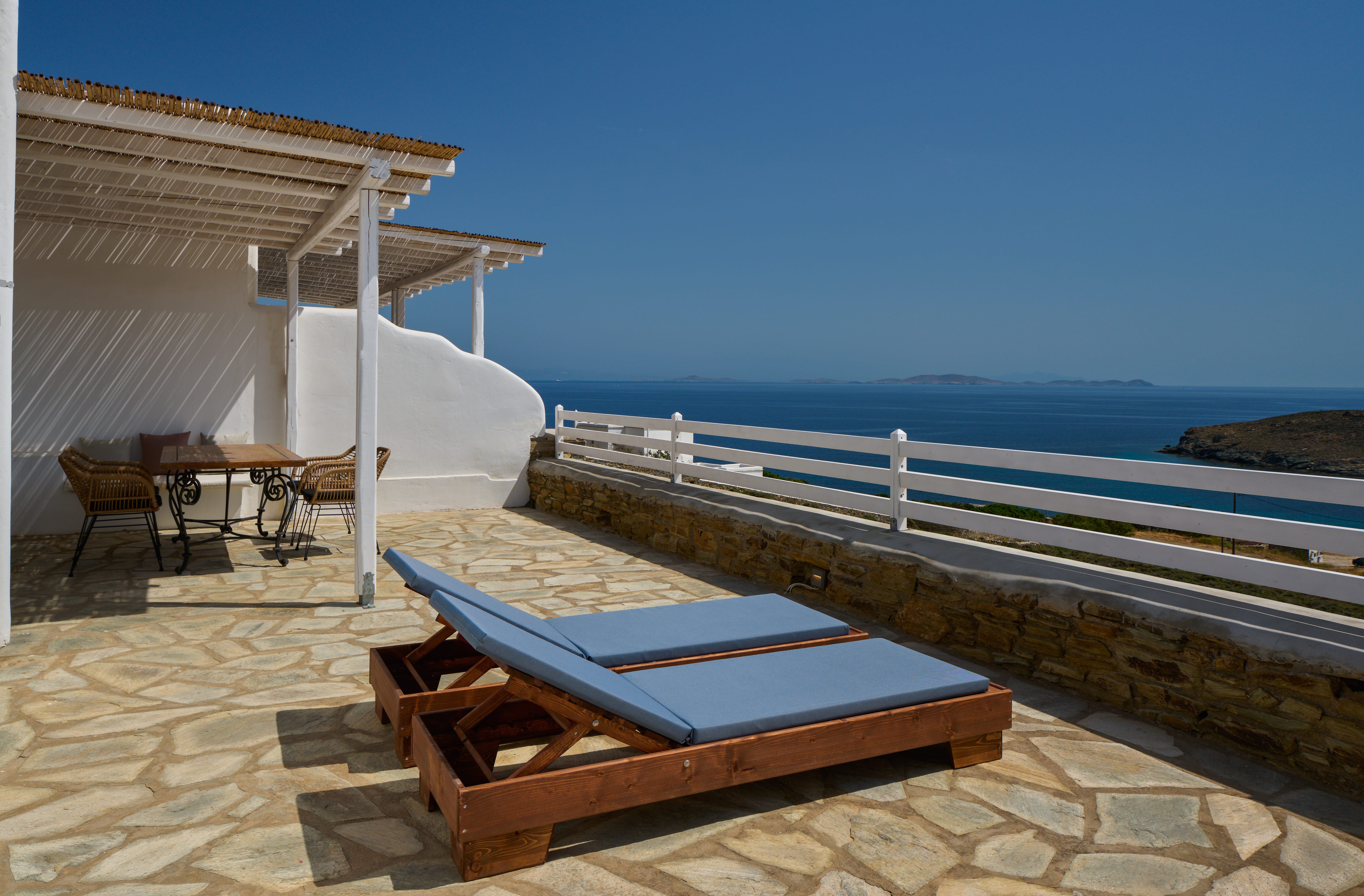 a deck with a pool and chairs