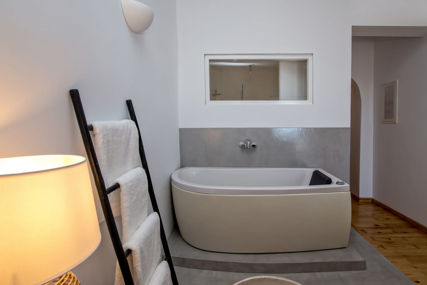 a white bathtub in a bathroom