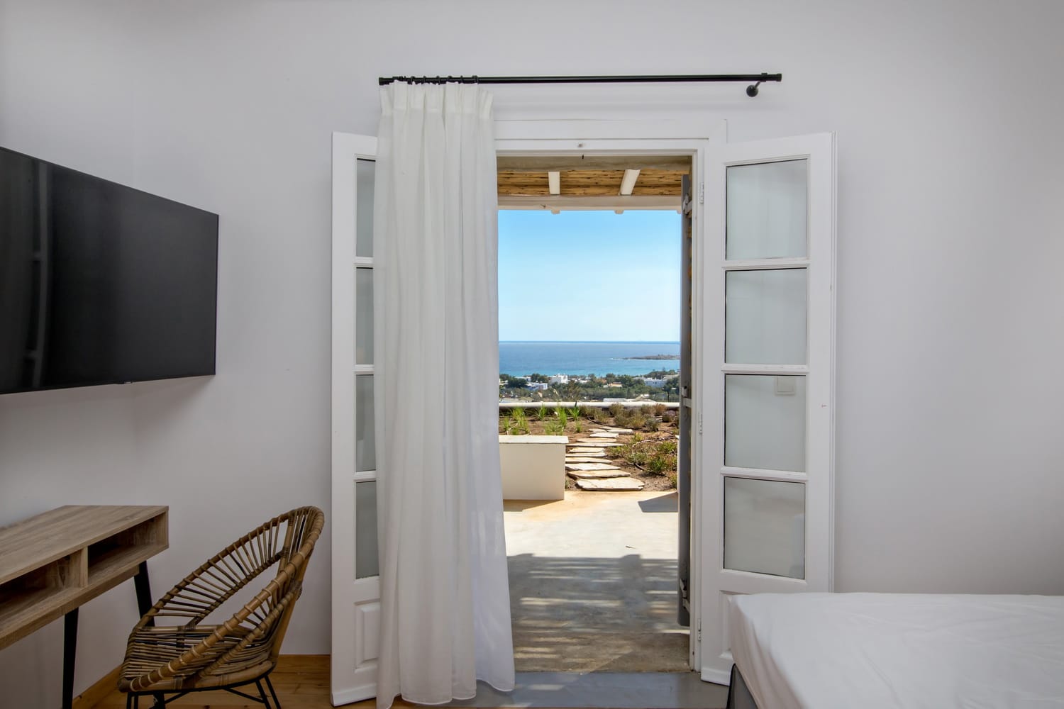 a room with a window and a chair