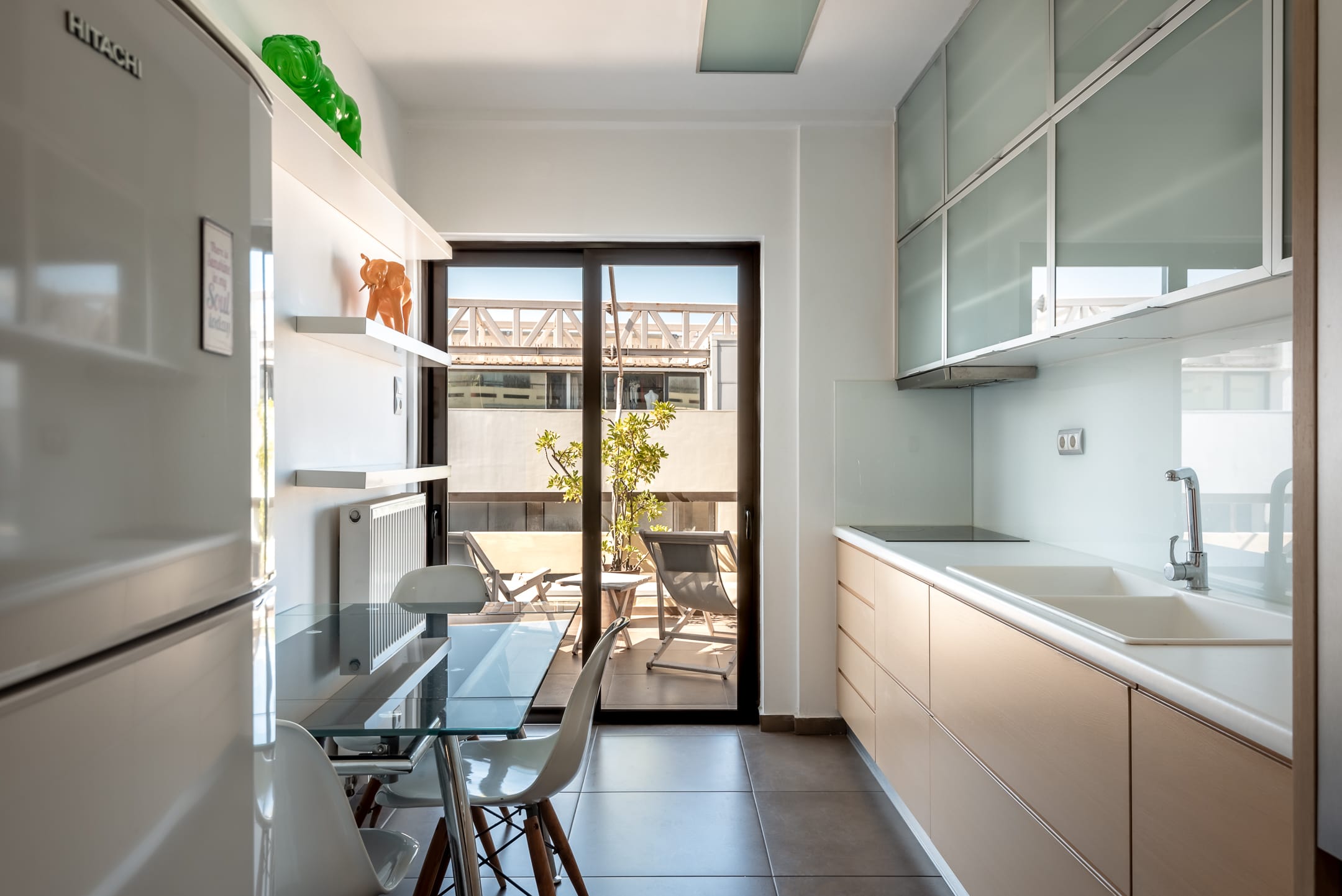 a kitchen with a table and chairs