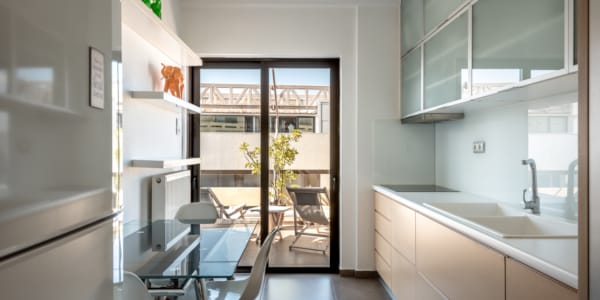 a kitchen with a table and chairs