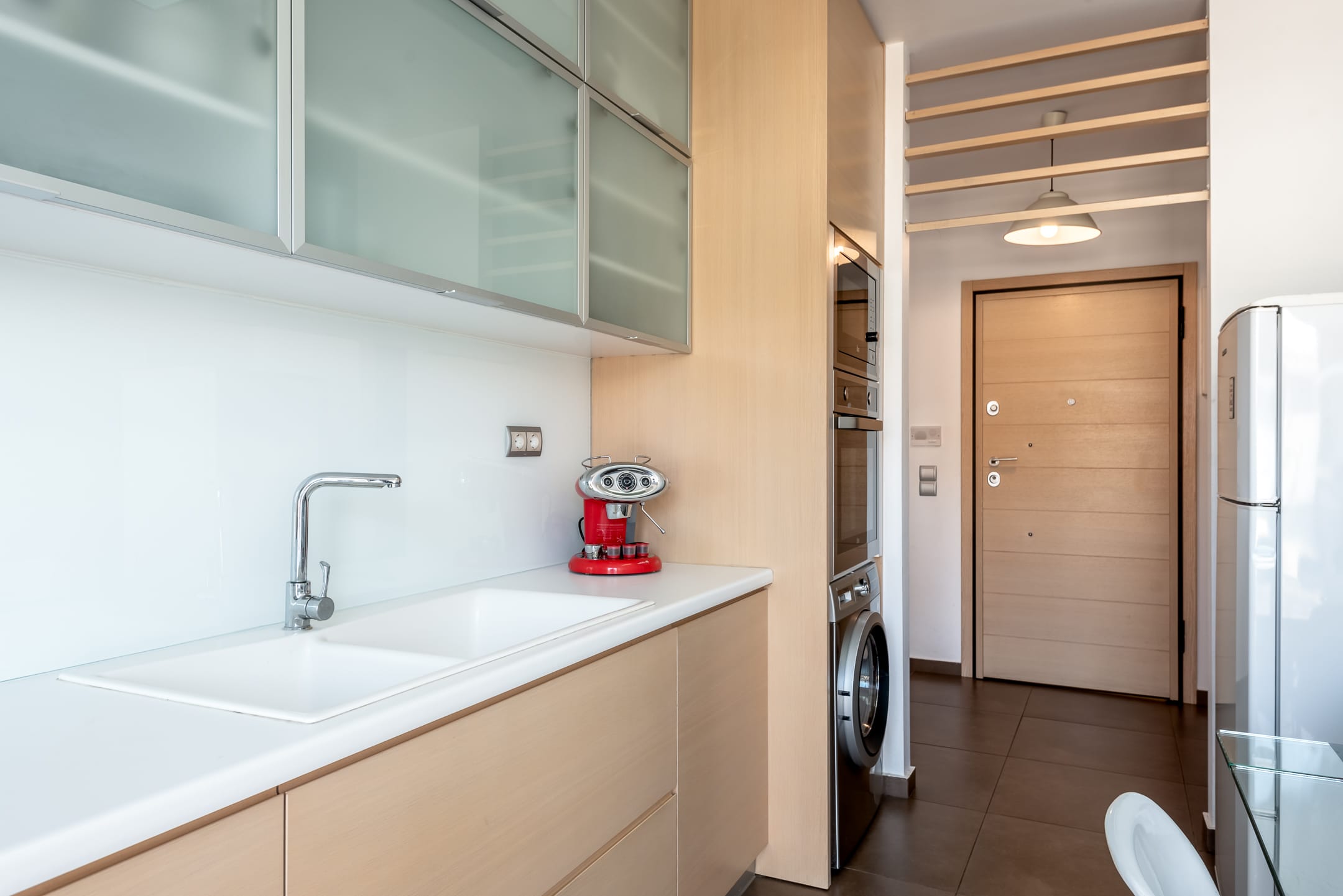 a kitchen with a washer and dryer