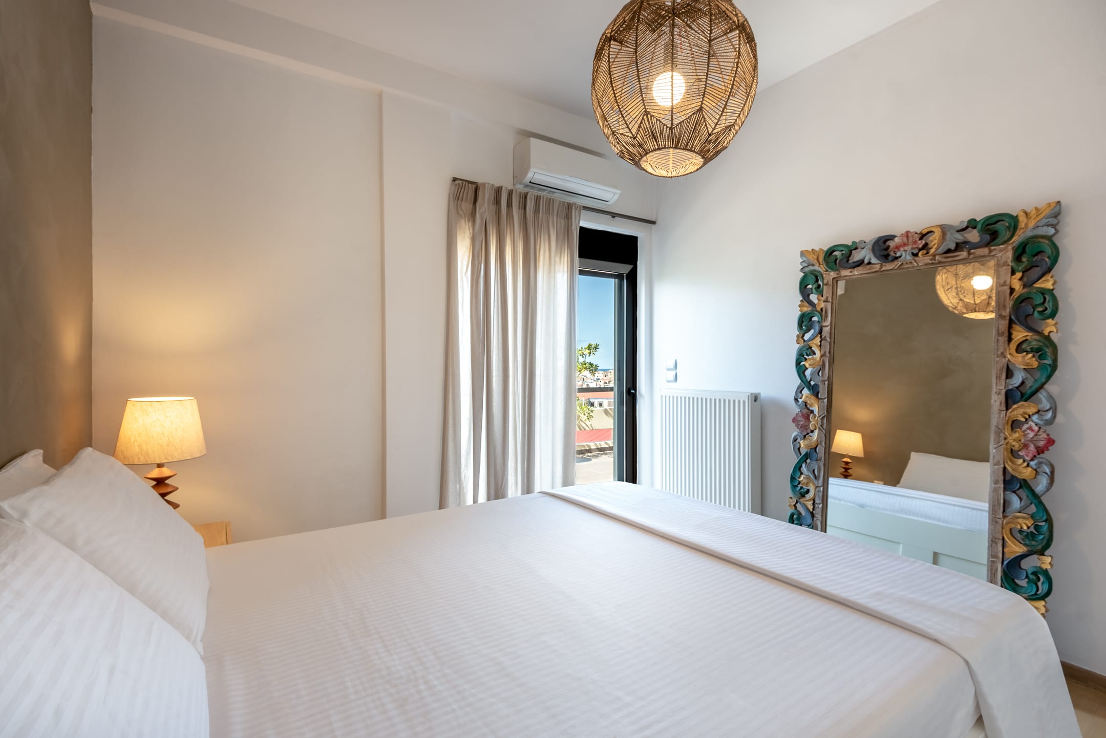 a bedroom with a large mirror