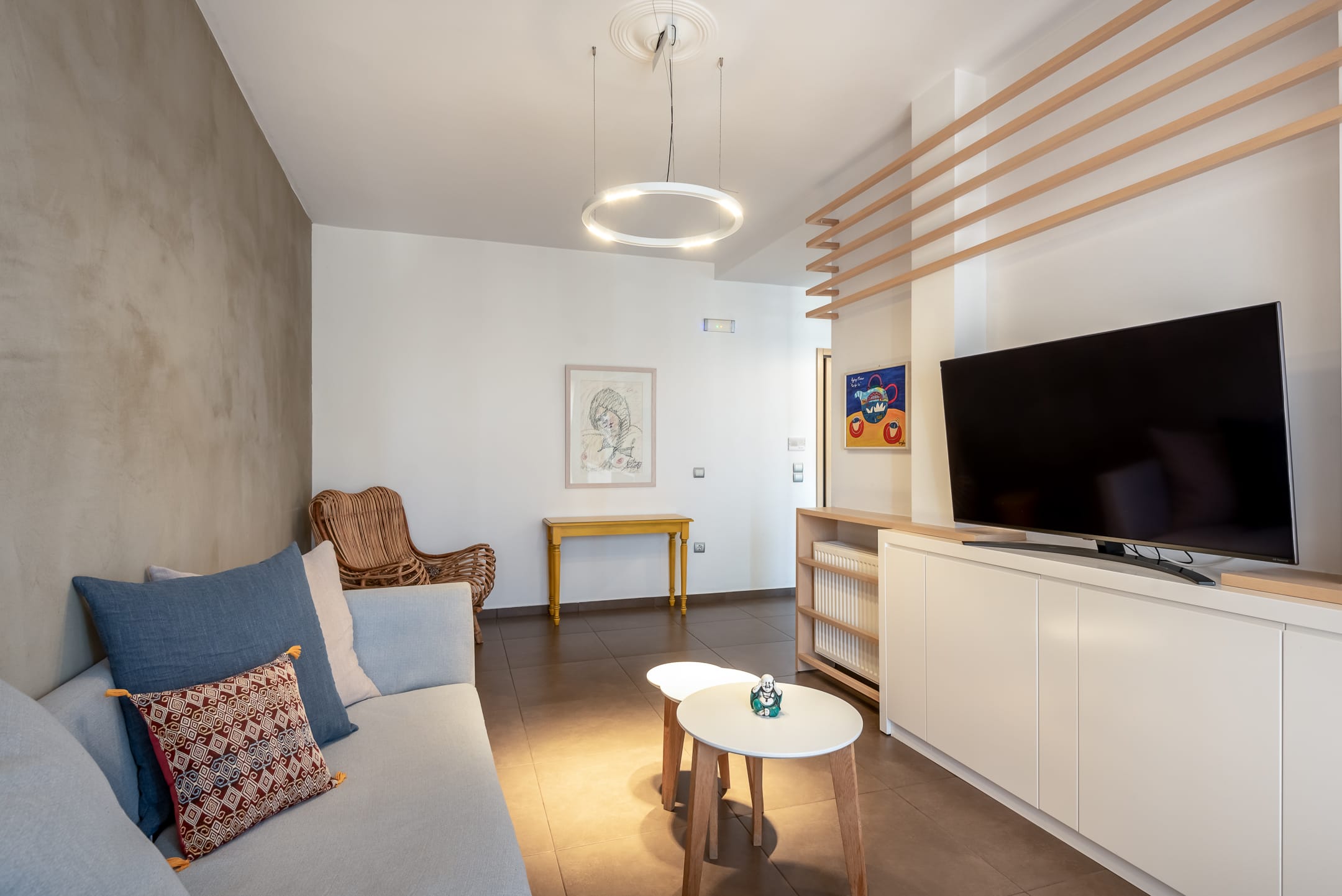 a living room with a tv and couches