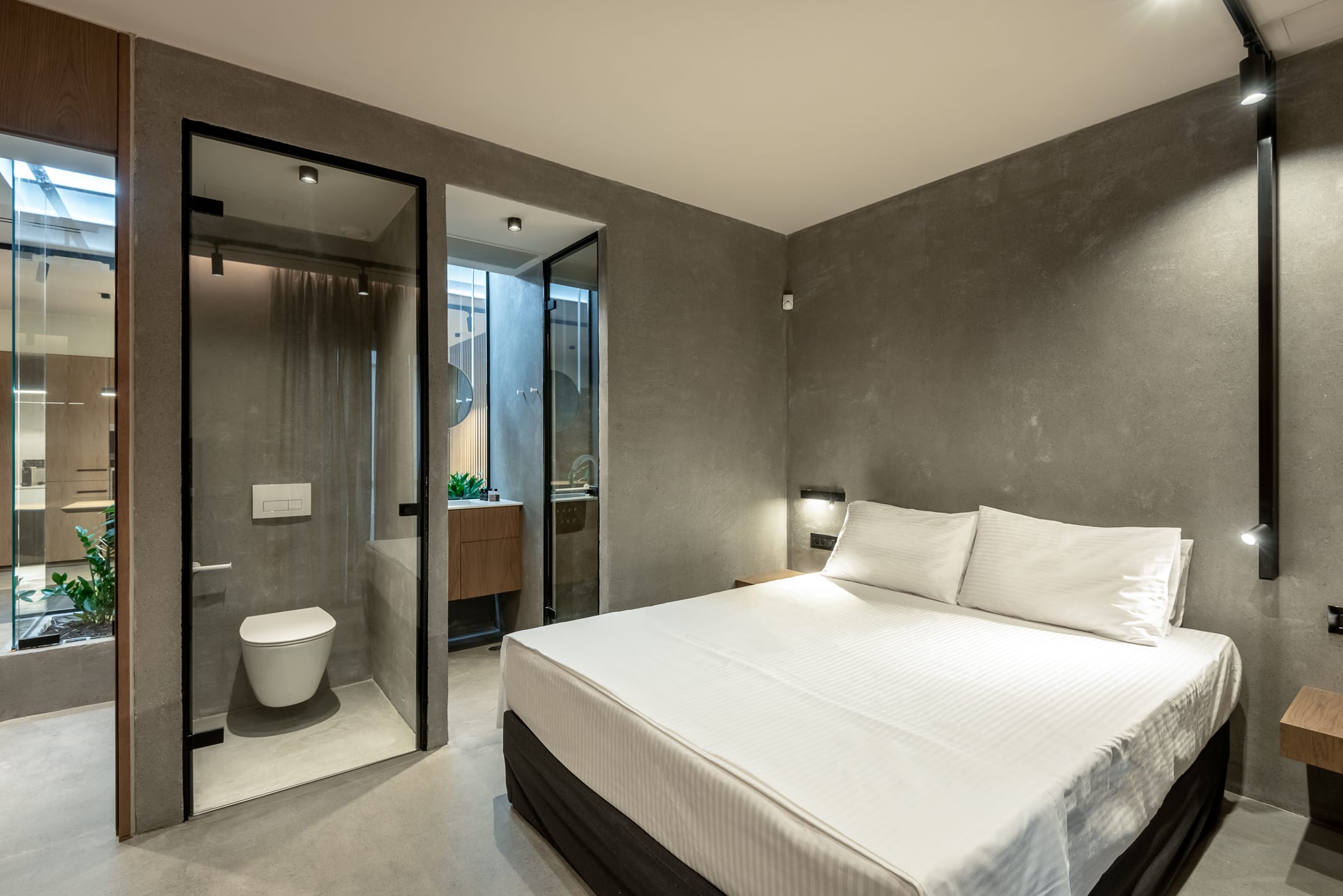 a bedroom with a large glass door