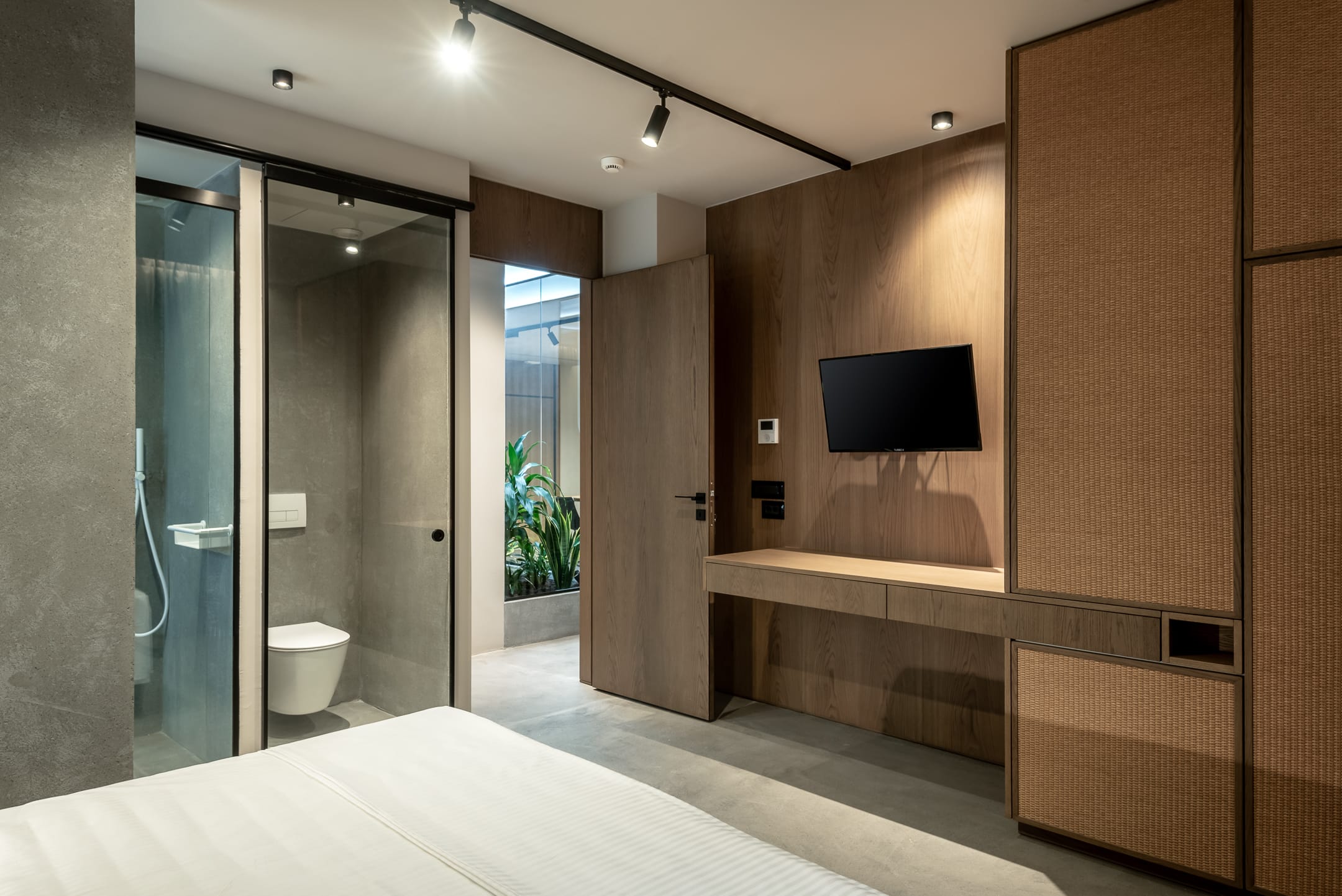 a bathroom with a tv and shower