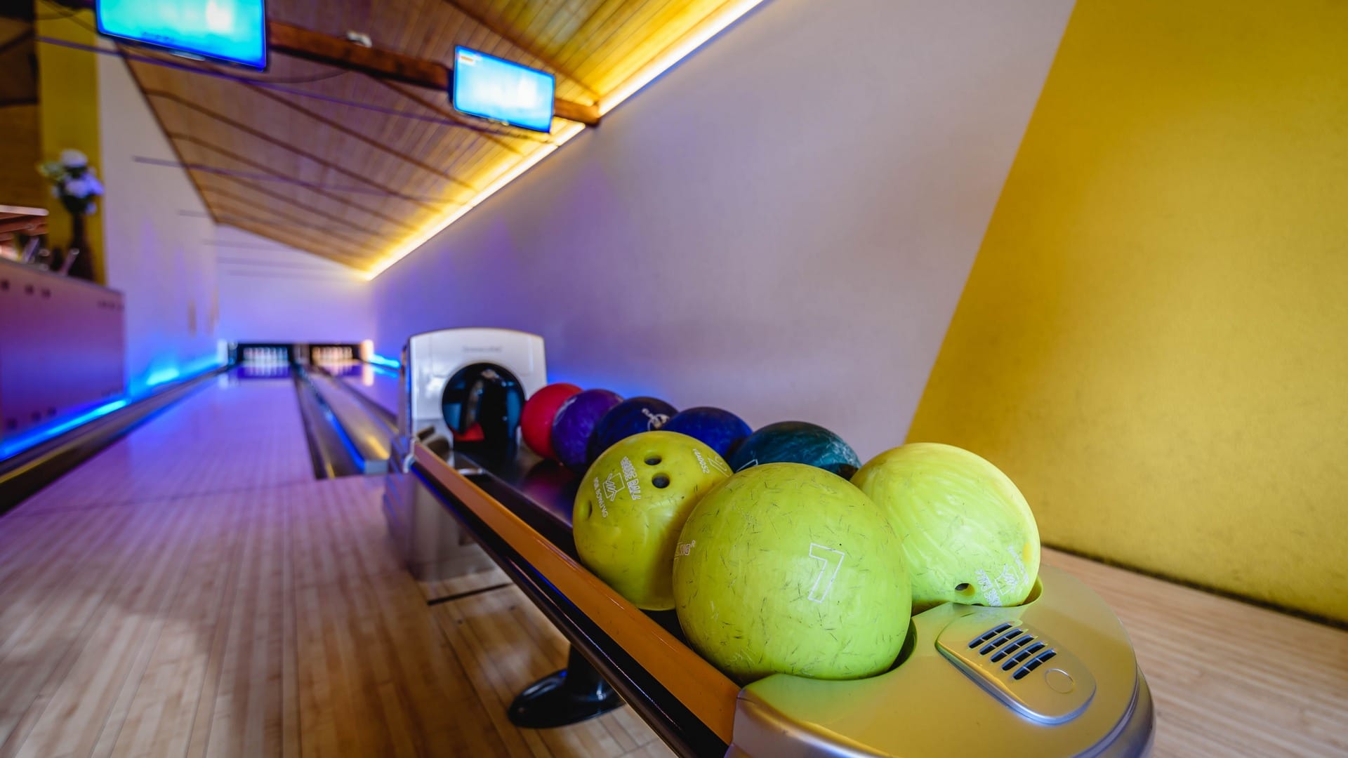 a group of bowling balls on a table