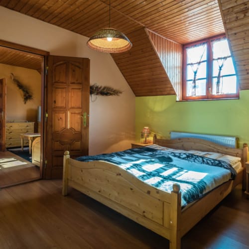 a bedroom with a bed and a window