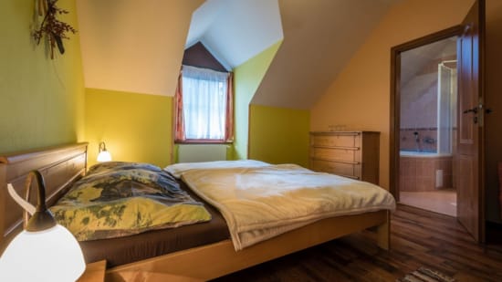 a couple of beds in a room