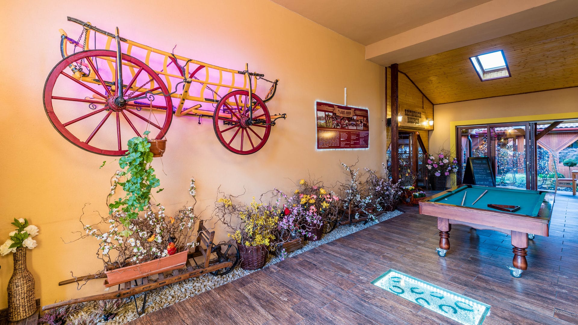 a room with a table and a bench with a bicycle on it